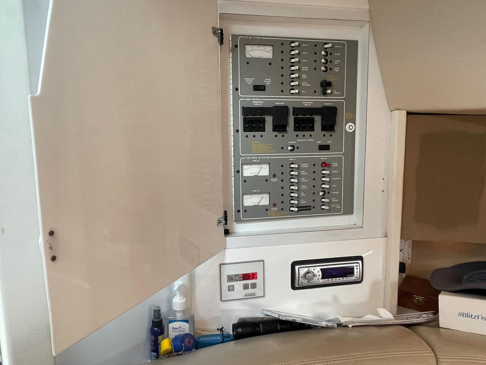 Electrical panel inside a 1998 Formula 41 PC boat, with open cabinet and control switches.