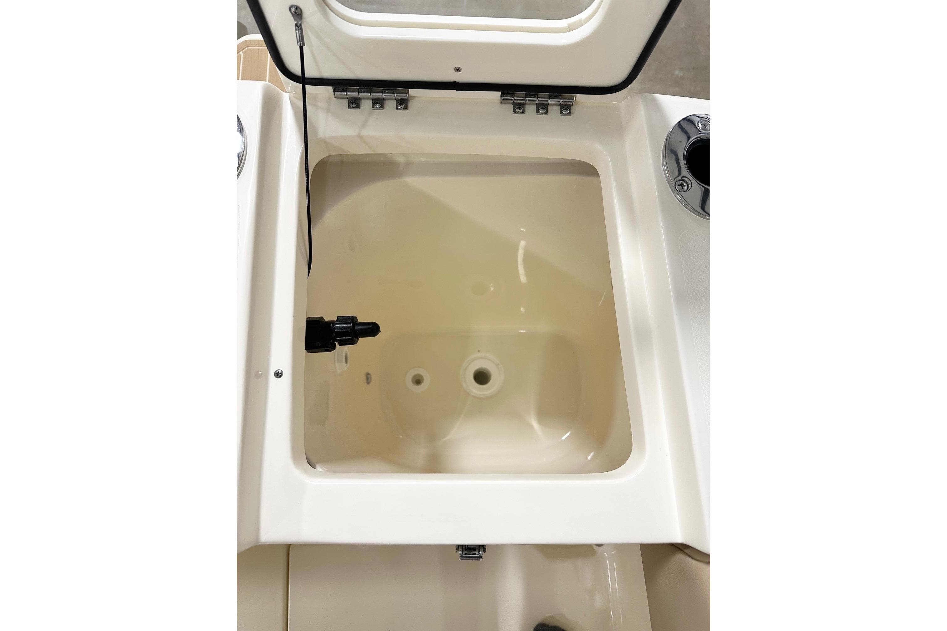 2026 Scout 240 XSF boat compartment with open lid, showcasing interior details.