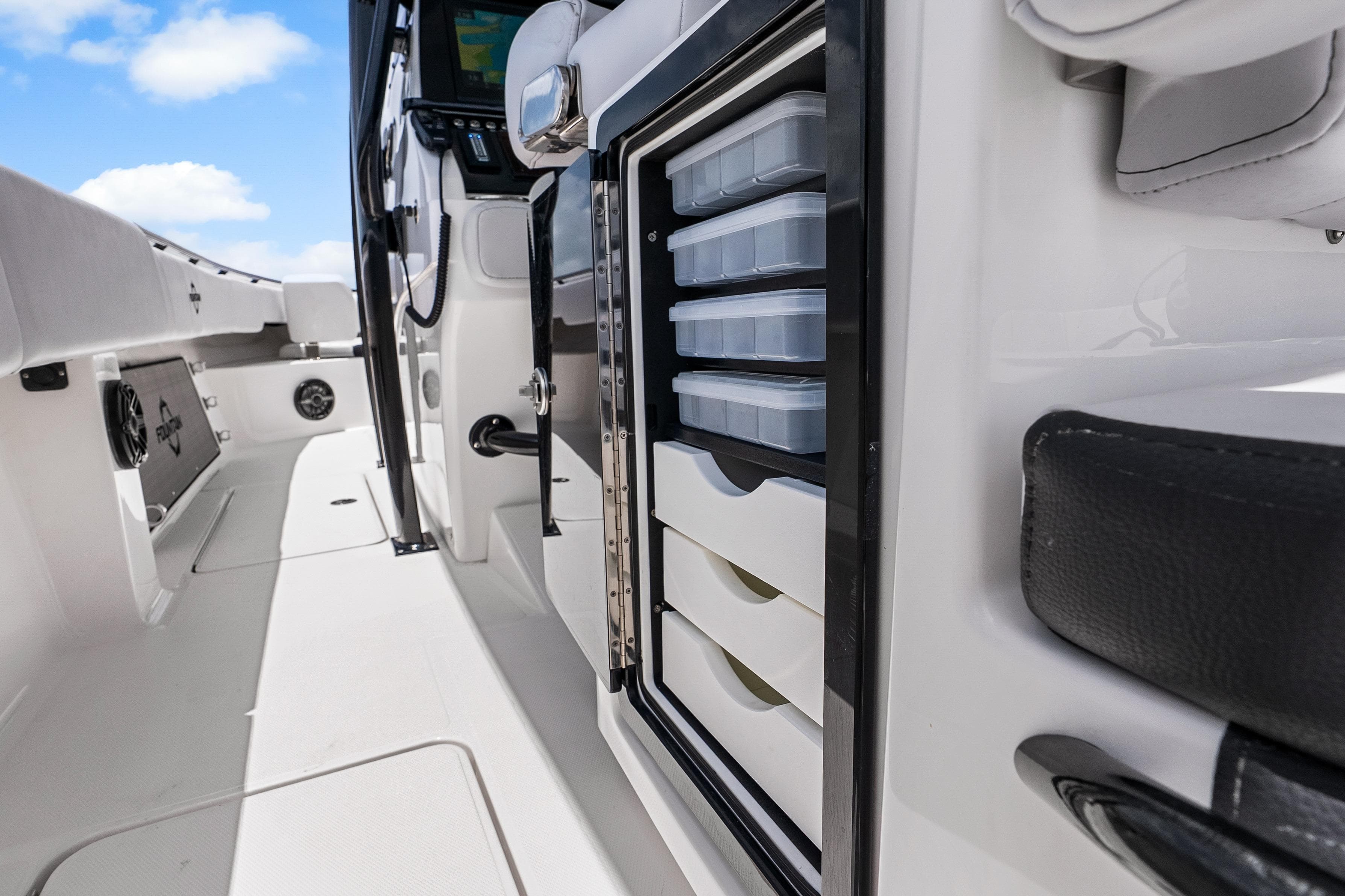 2025 Fountain 34 Center Console boat interior with storage compartments and sleek design.