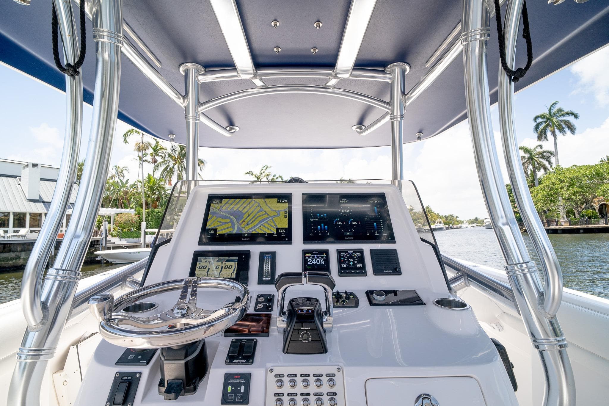 2021 Intrepid 400 Center Console boat dashboard with navigation screens and steering wheel.