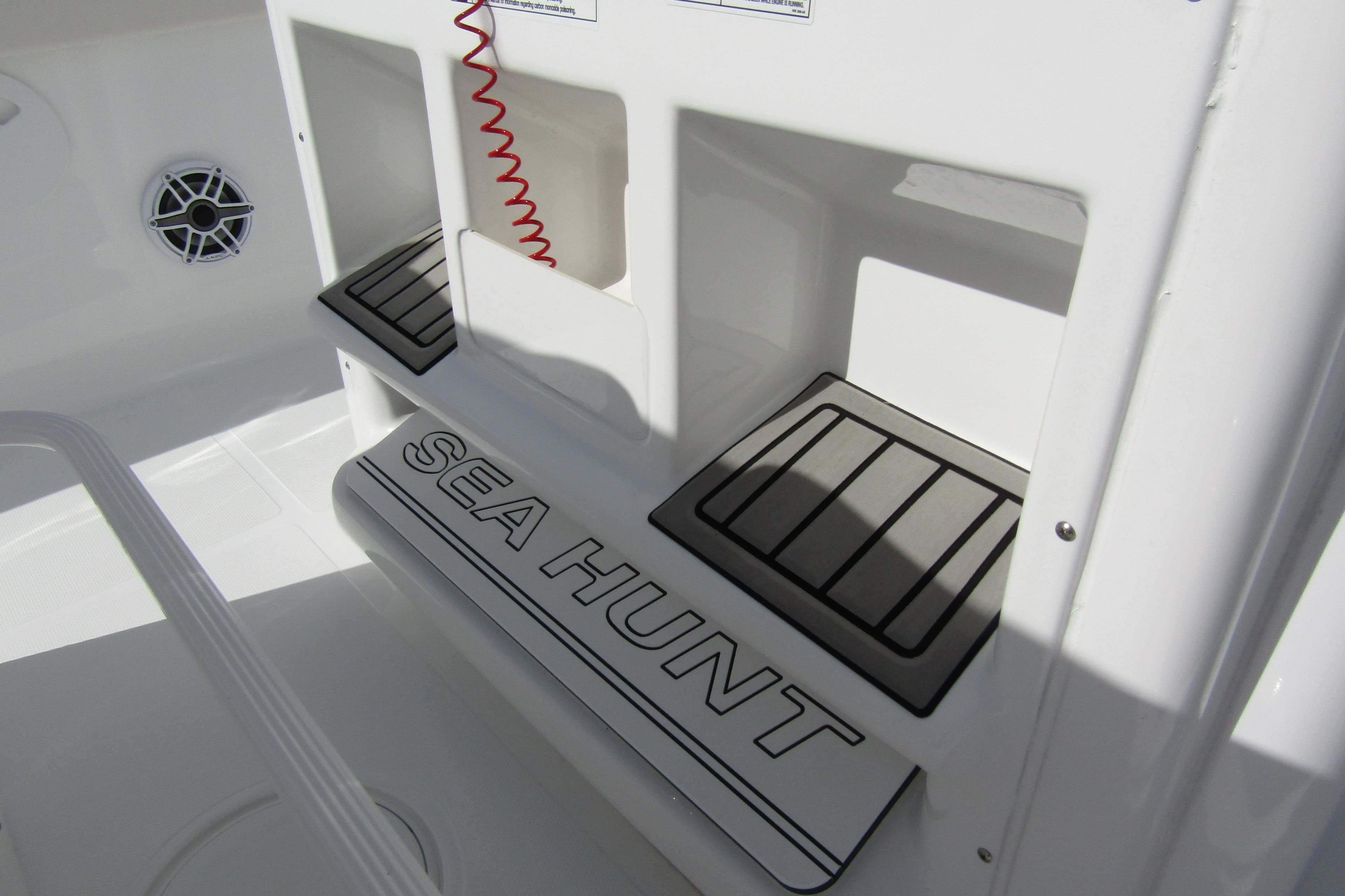 2025 Sea Hunt Ultra 275 SE boat interior with branded step and speaker.