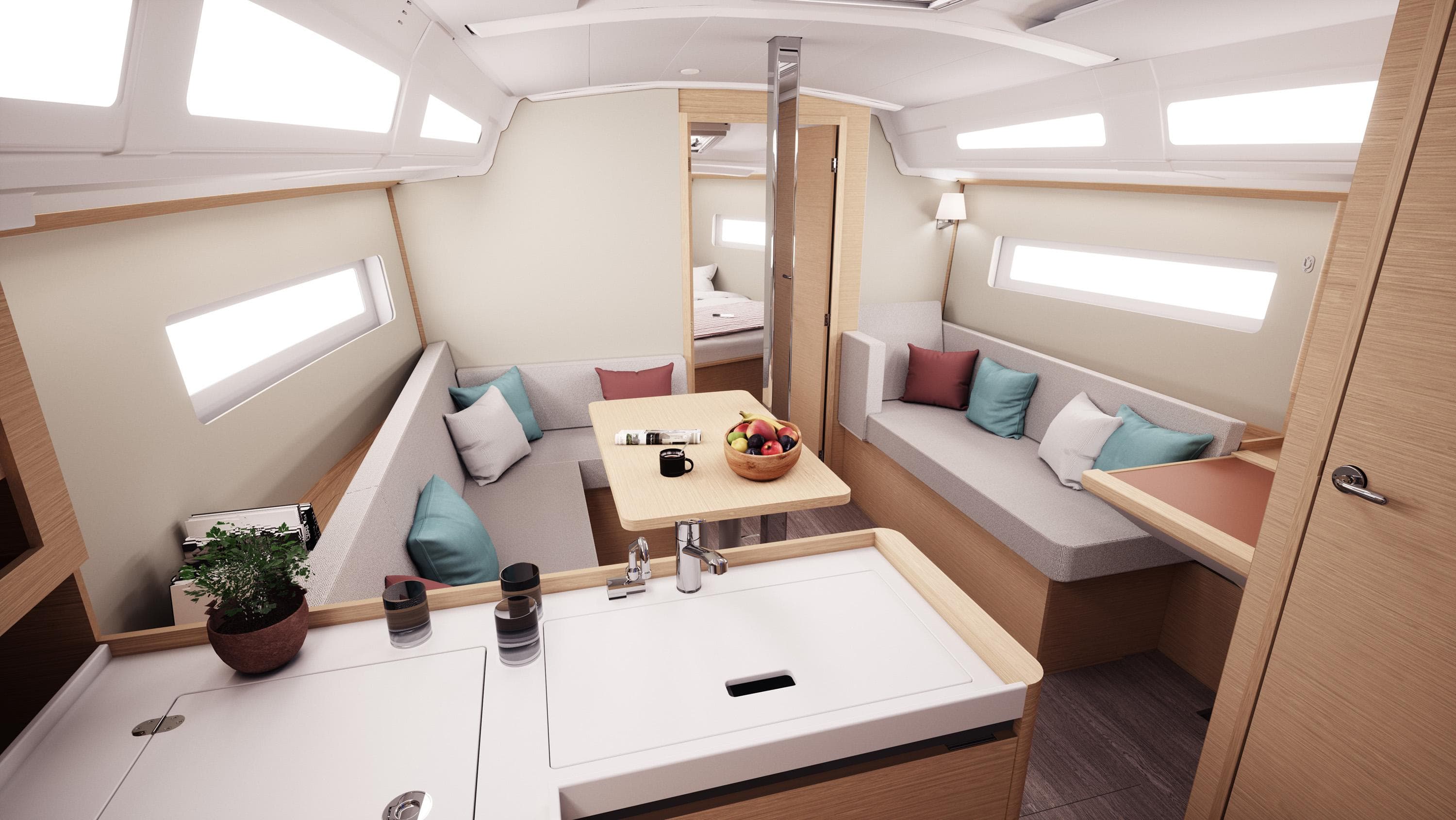 Interior of 2026 Jeanneau Sun Odyssey 380 yacht, featuring modern seating and dining area.