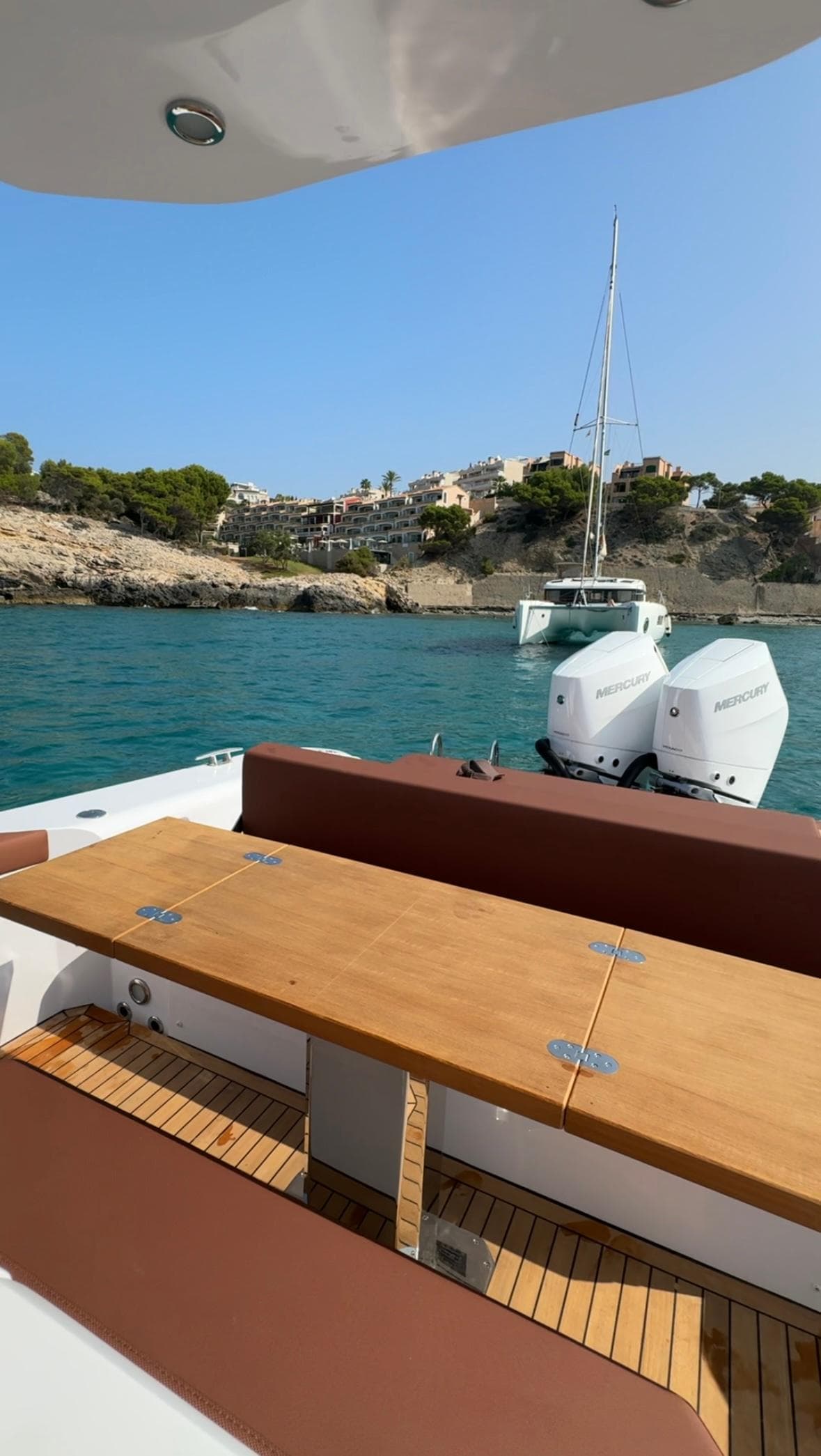 Luxury Pirelli 35 yacht, 2024 model, cruising near scenic coastline with clear blue waters.