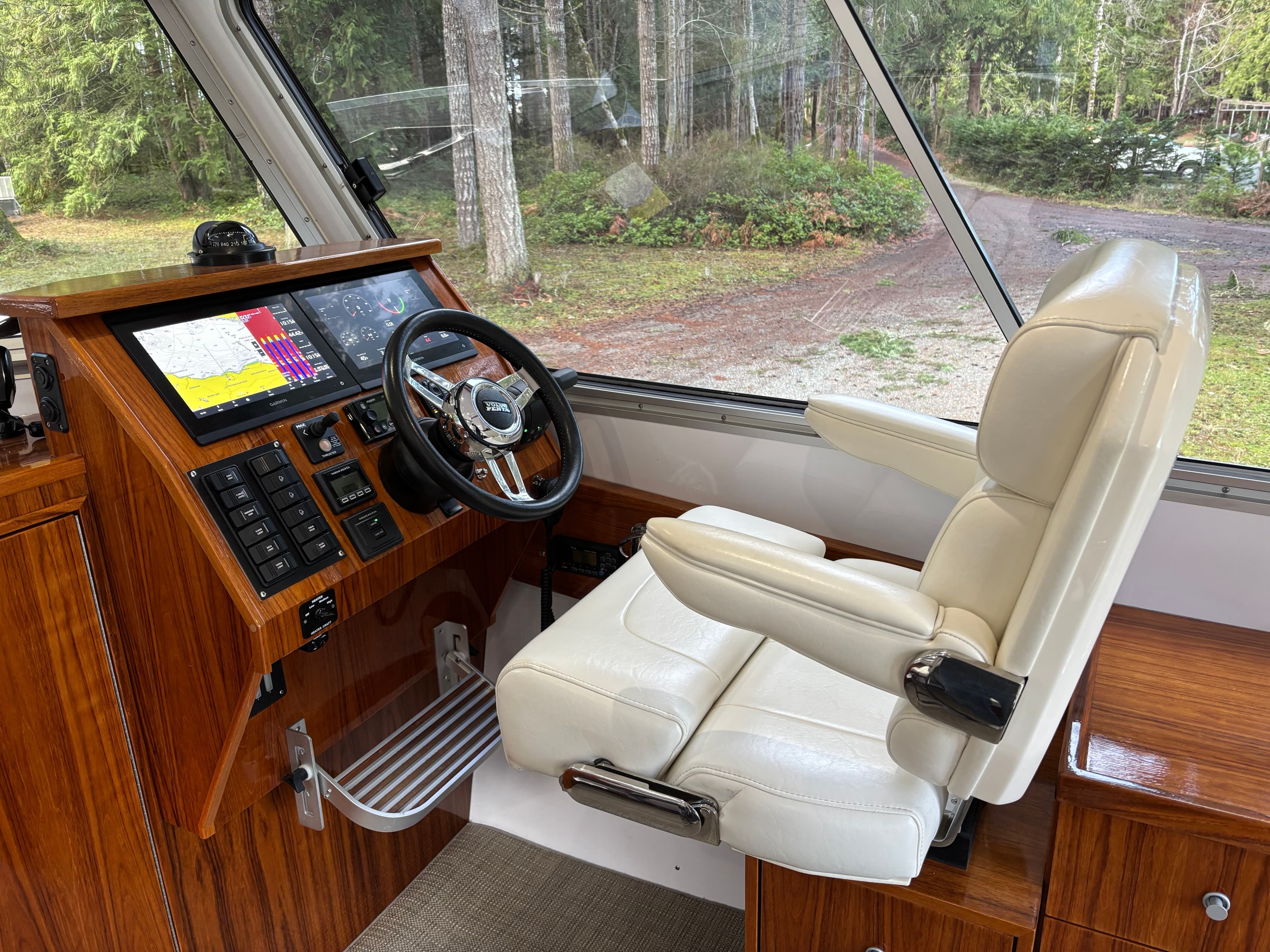 Interior of a 2020 Walker Custom 30 boat with steering console.