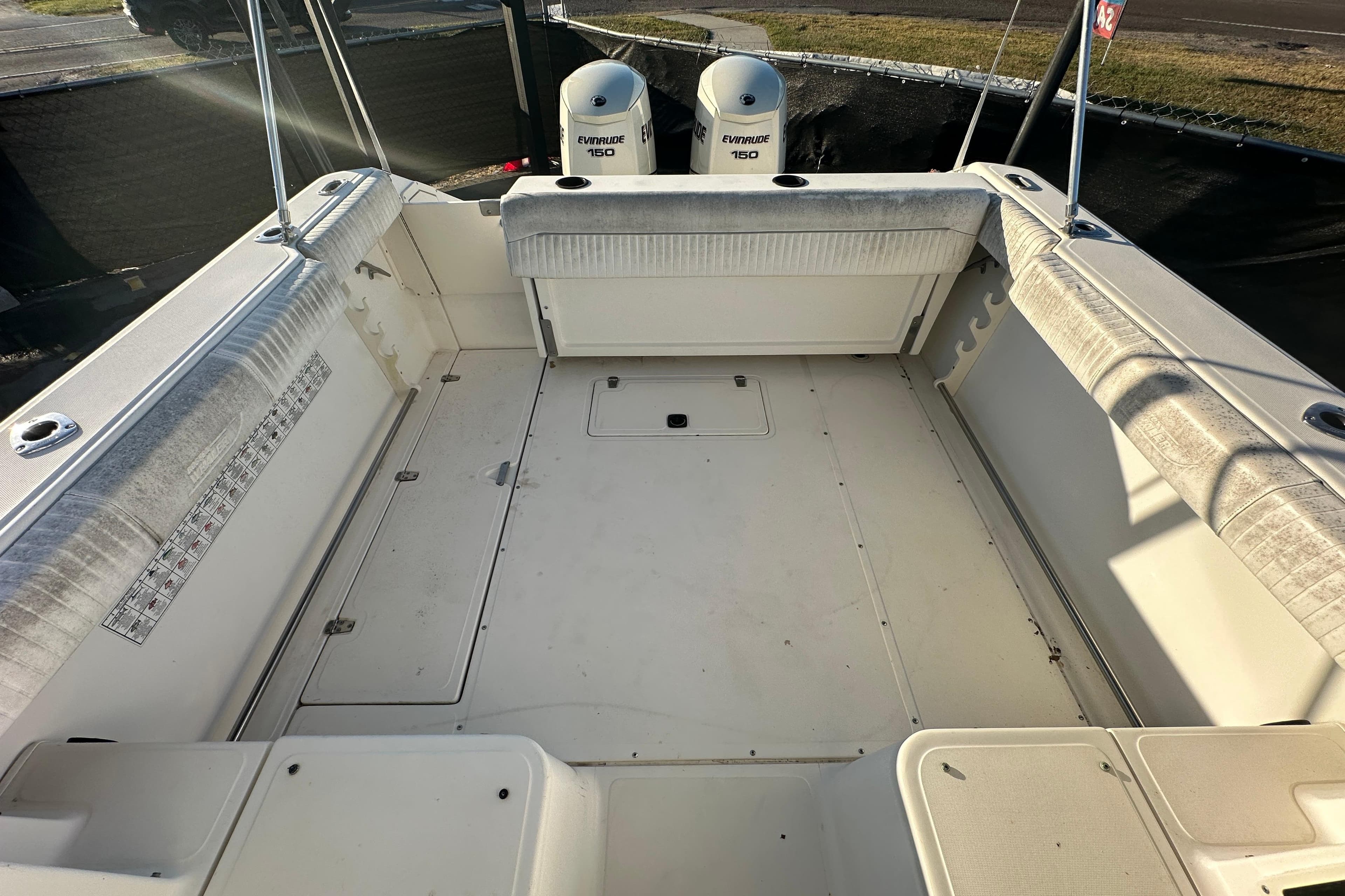2001 Boston Whaler 23 Conquest boat interior with Evinrude 150 engines, spacious deck.