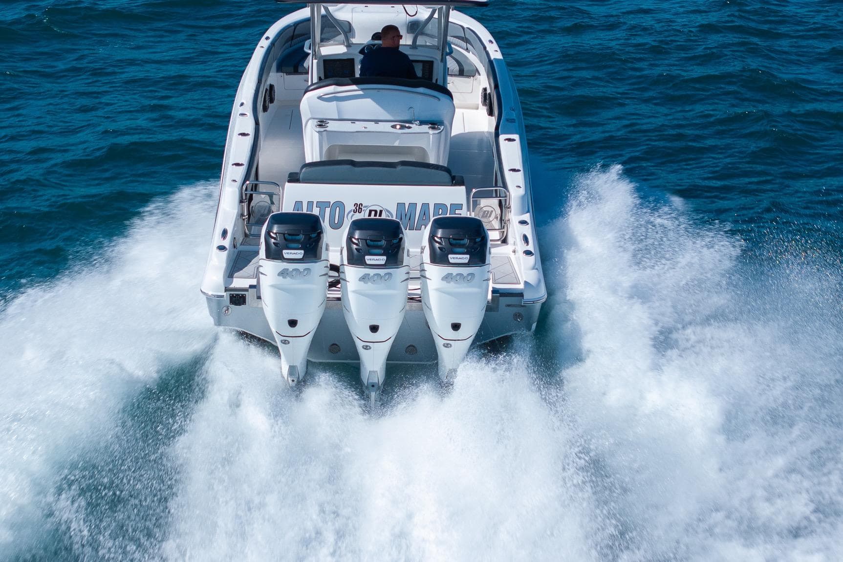 2019 Deep Impact 369 Sport boat with triple engines cruising on open water.