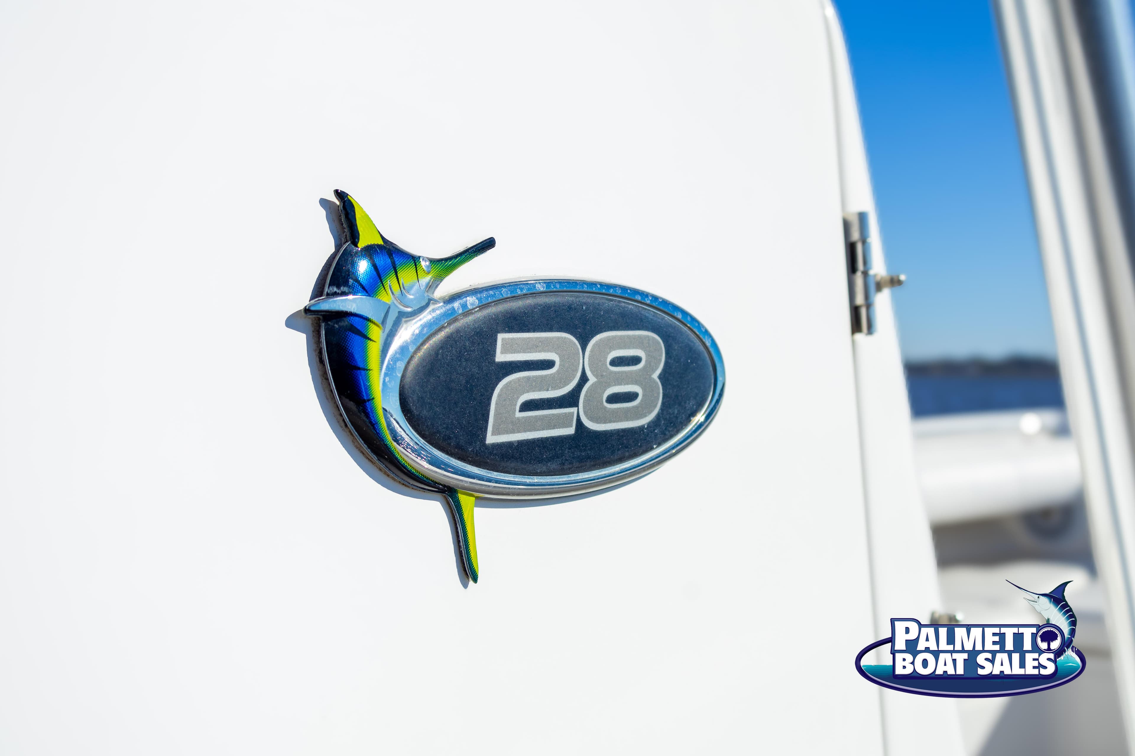 Regulator 28 boat emblem, 2011 model, with Palmetto Boat Sales logo.