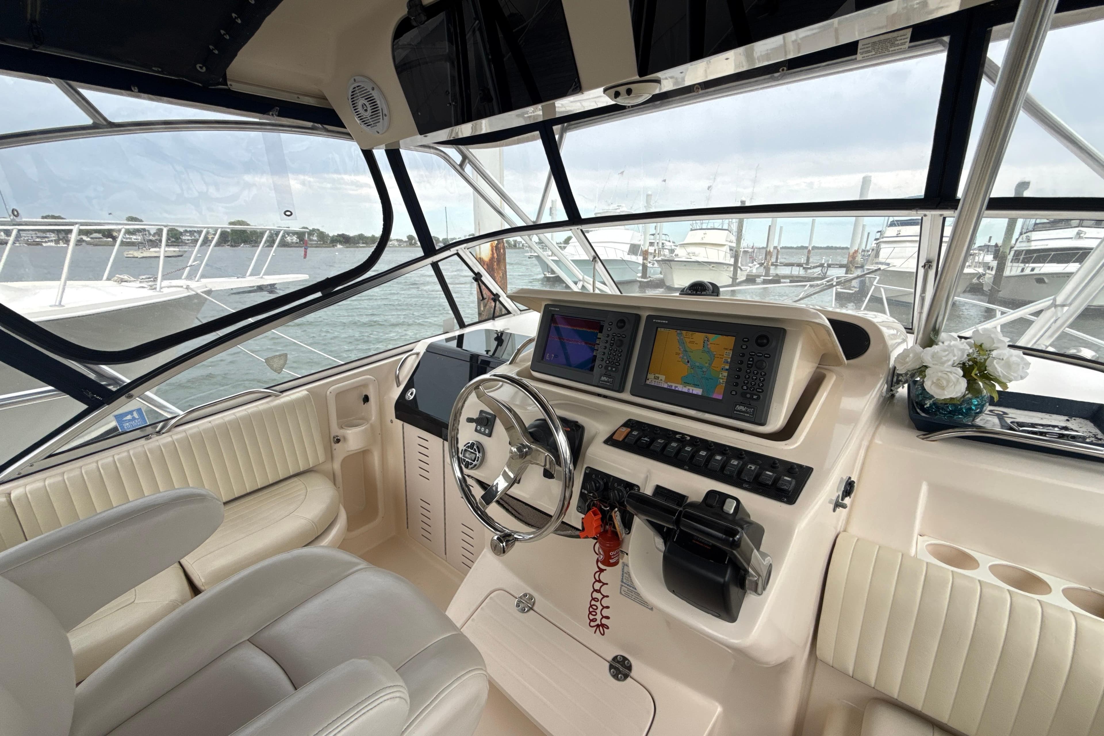 Interior view of 2005 Grady-White Express 330 boat cockpit with navigation equipment.