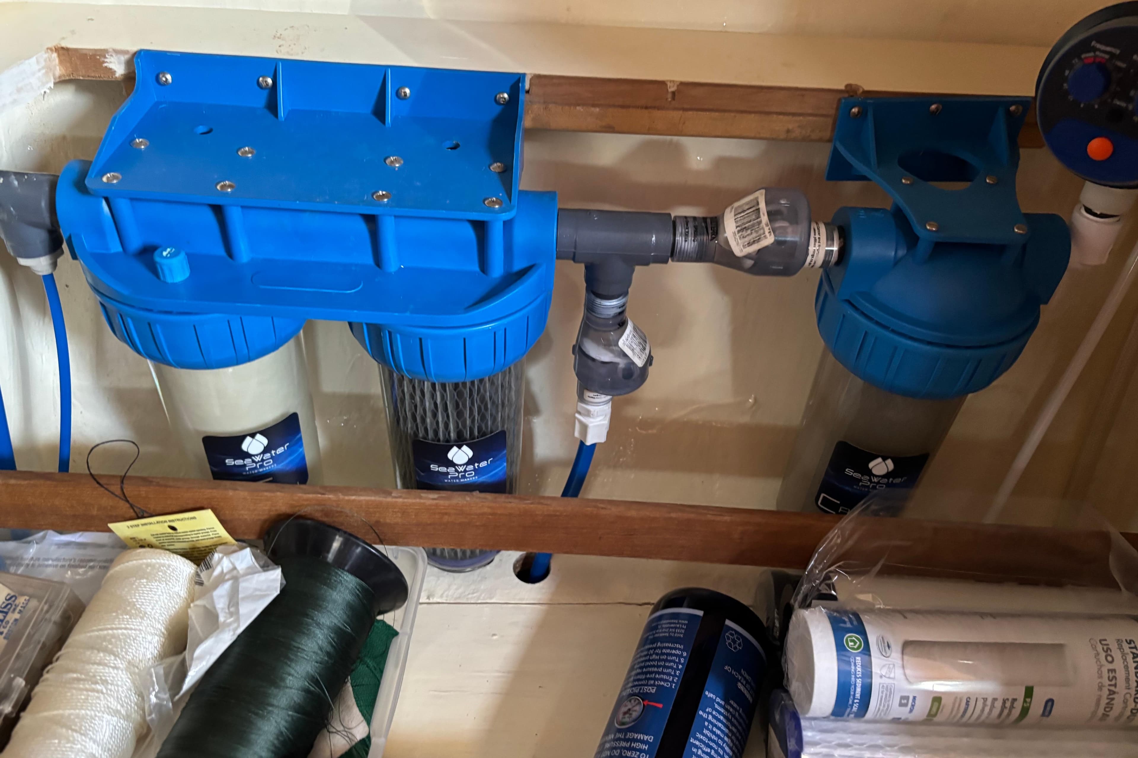 Water filtration system on a 1981 Bruce Roberts Offshore 45 yacht, featuring blue filter housings.