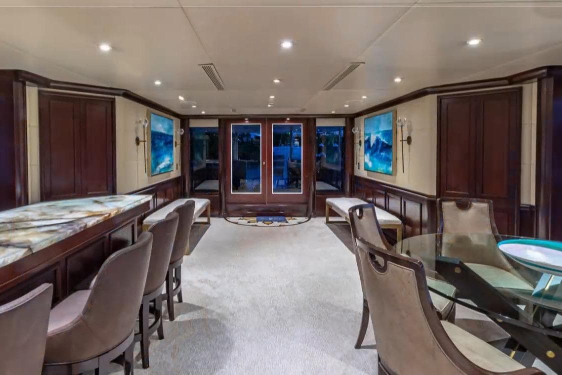 Luxurious interior of 1988 Van Mill 143 Tri-Deck Motor Yacht with elegant seating and decor.