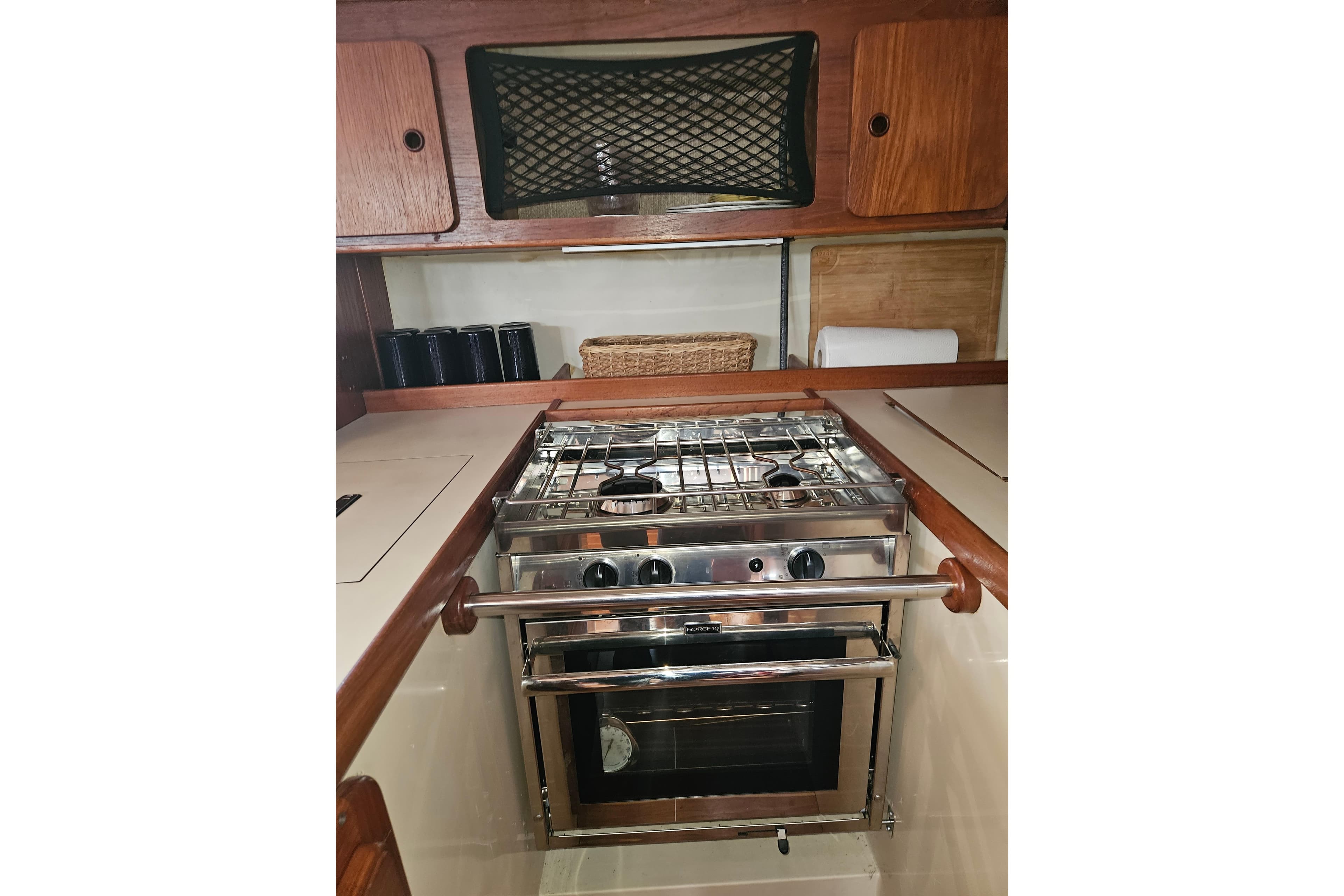 Galley kitchen in 1987 Morgan Classic 41 Center Cockpit yacht with stove and storage.