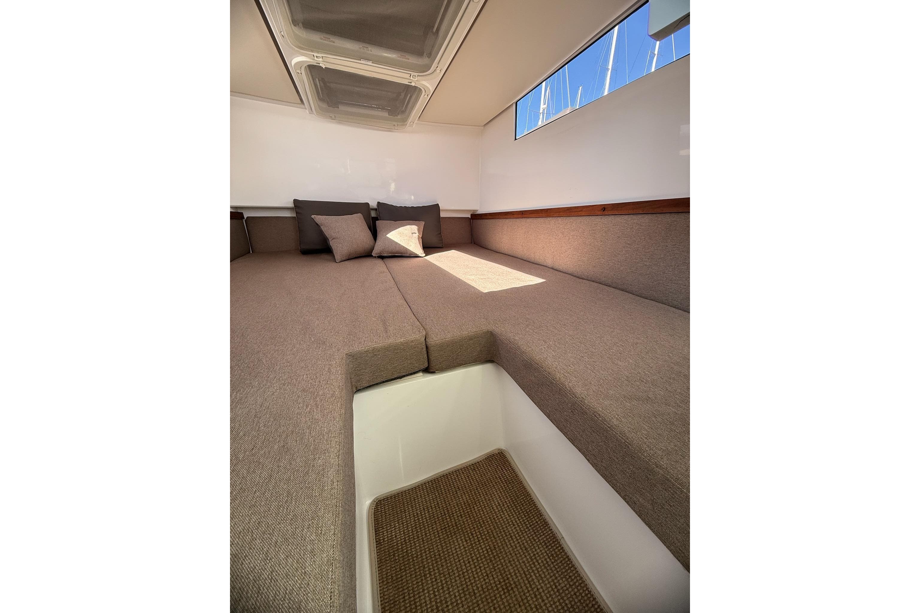 Cozy cabin interior of 2016 Axopar 37 XC CROSS CABIN with comfortable bedding.