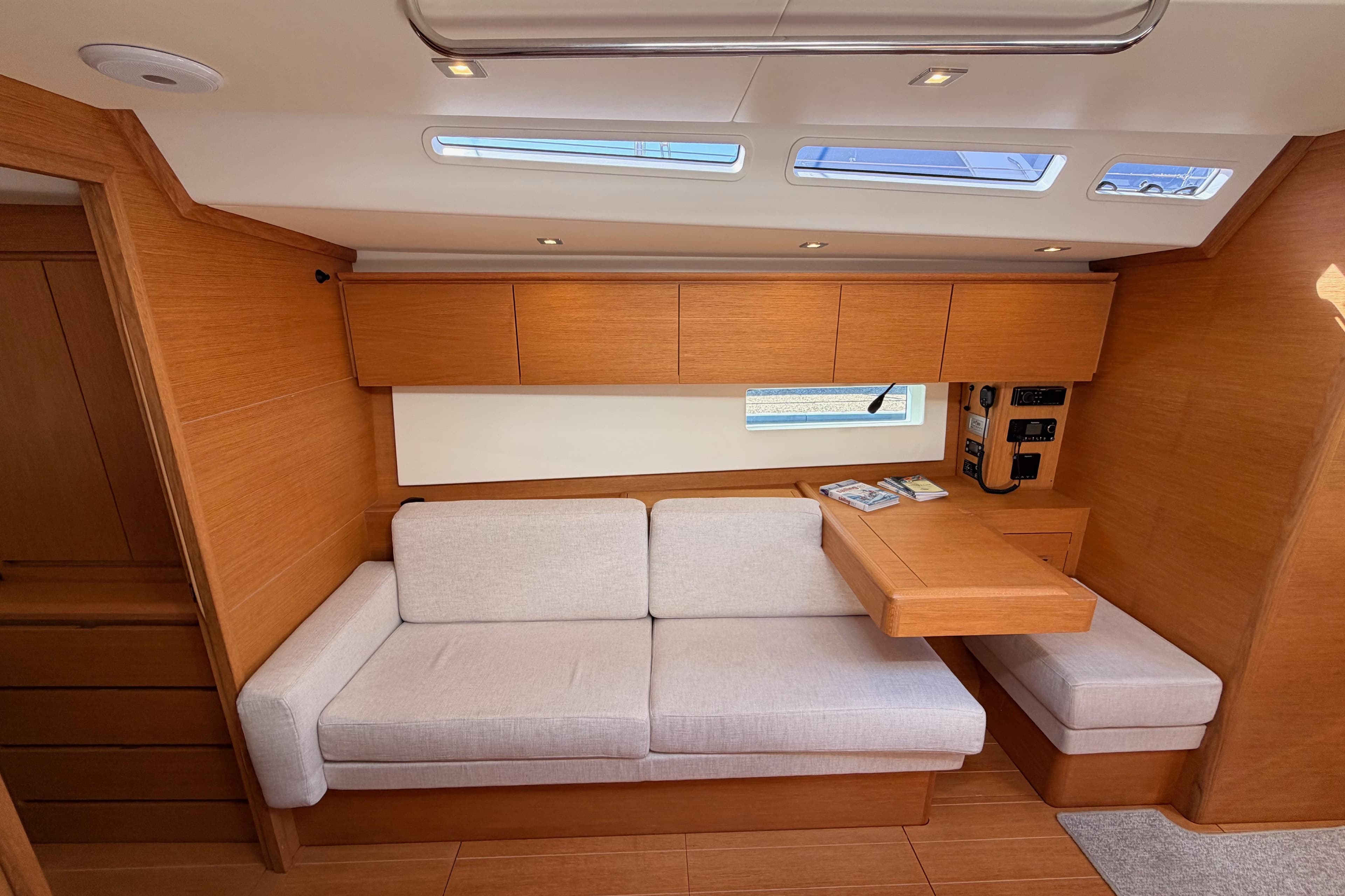 Luxurious interior of a 2017 Solaris 50 yacht with modern wood finish and comfortable seating.