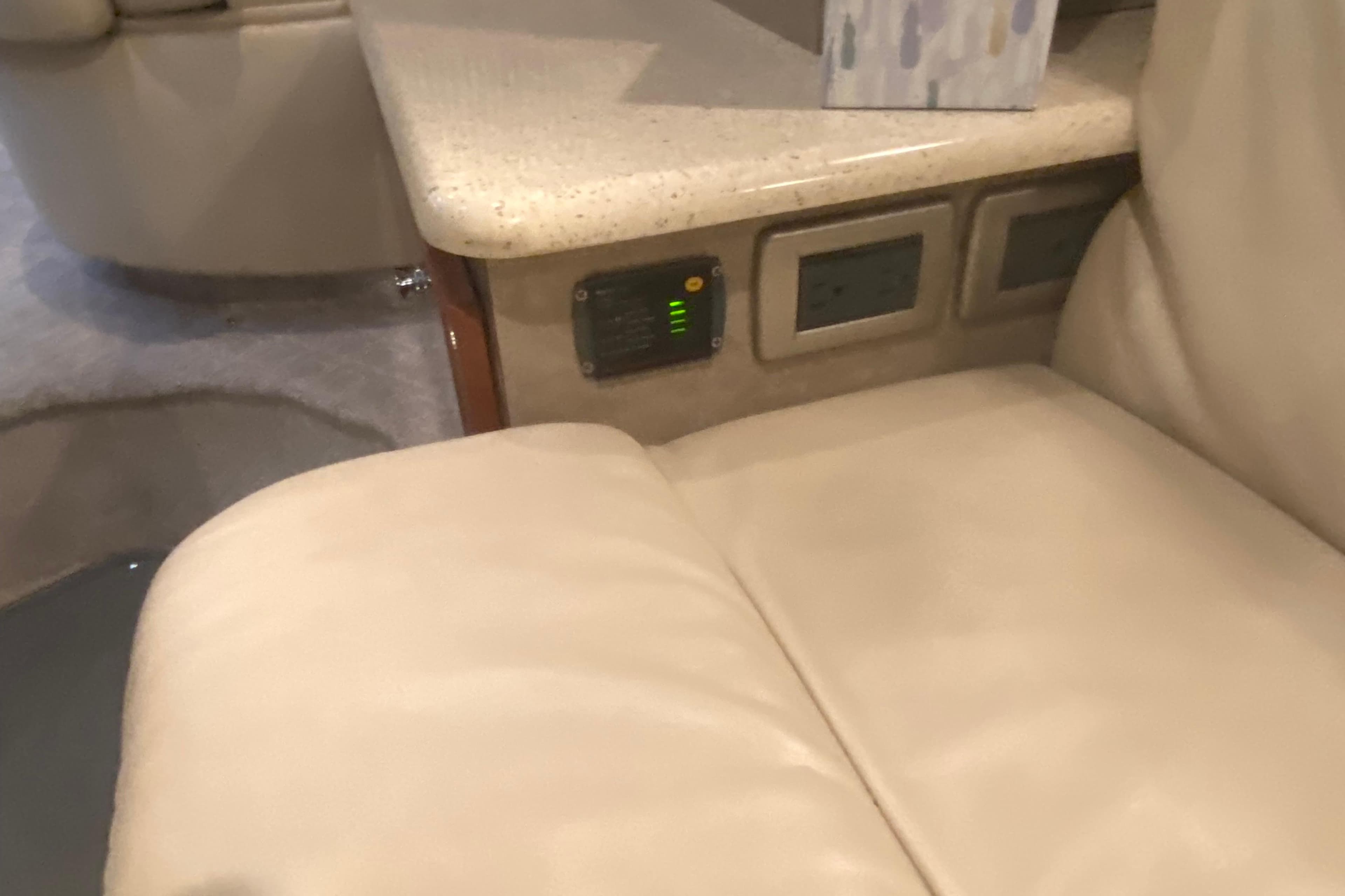 Luxurious beige leather seating with control panel in 2005 Formula interior.