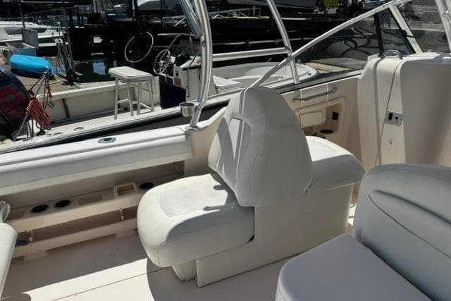 2012 Grady-White Freedom 275 boat interior with white seating and helm station.