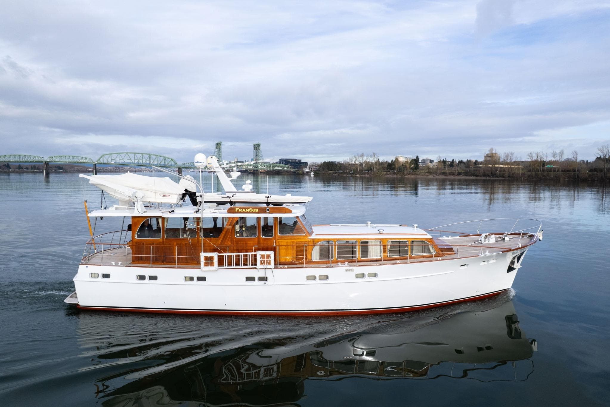 Classic 1965 De Vries Lentsch 64 Motoryacht cruising on calm waters.