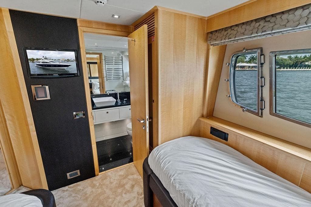 Luxurious interior of 2012 Sunseeker 88 Yacht with bedroom and ensuite bathroom.
