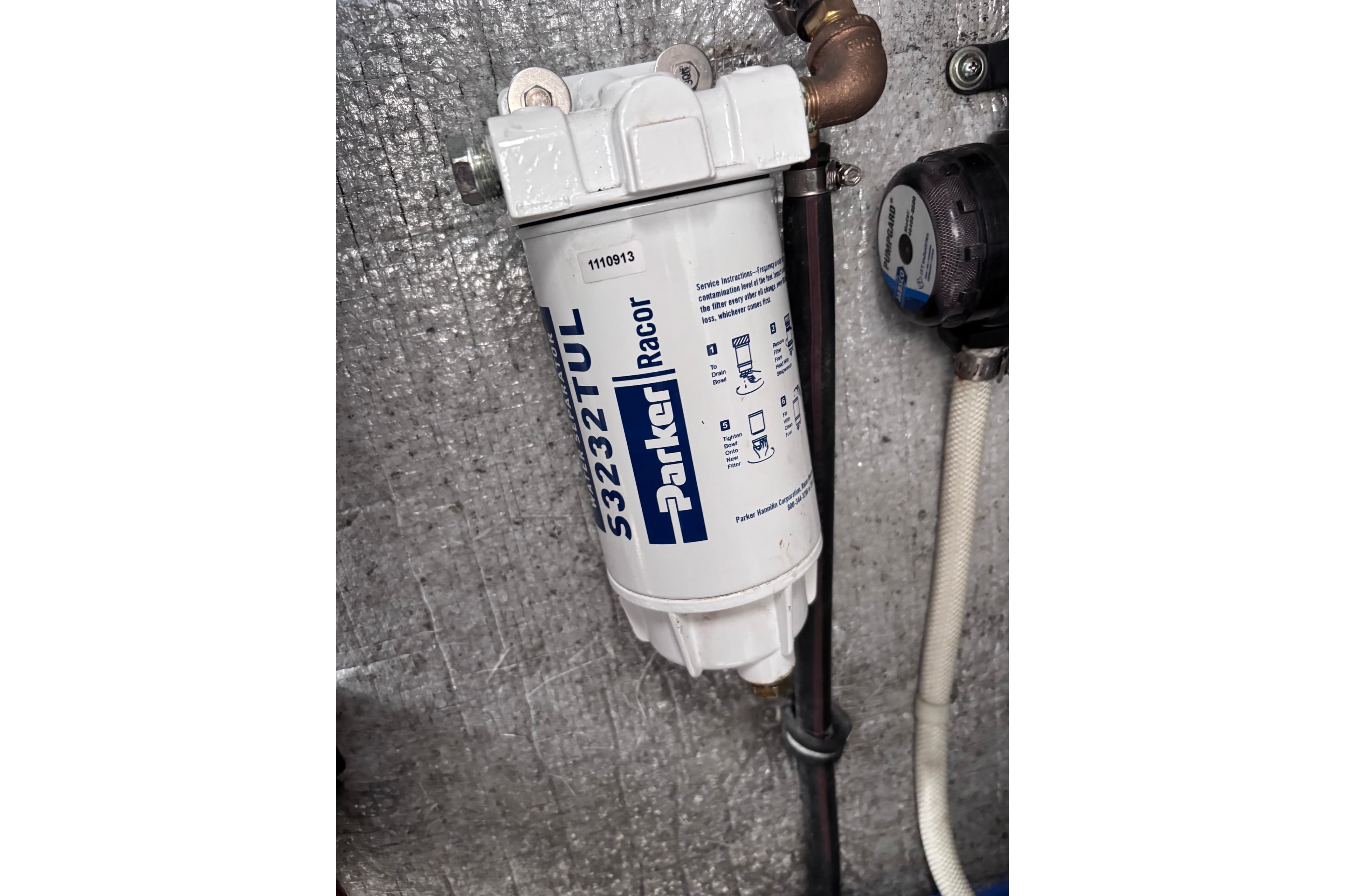 Parker Racor fuel filter in a 2007 Rinker EX 370 boat engine compartment.
