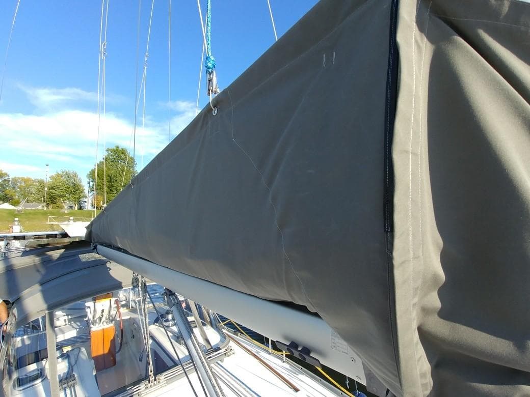 2008 Beneteau 343 sailboat with gray sail cover.