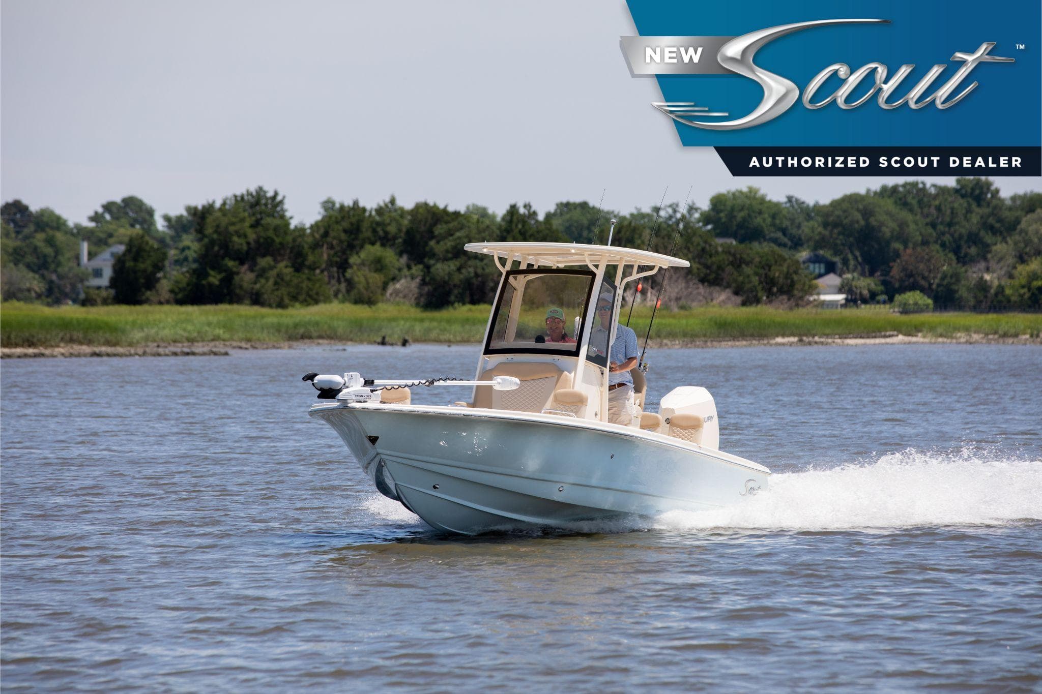 2025 Scout 231 XSB boat cruising on a serene lake with lush greenery in the background.