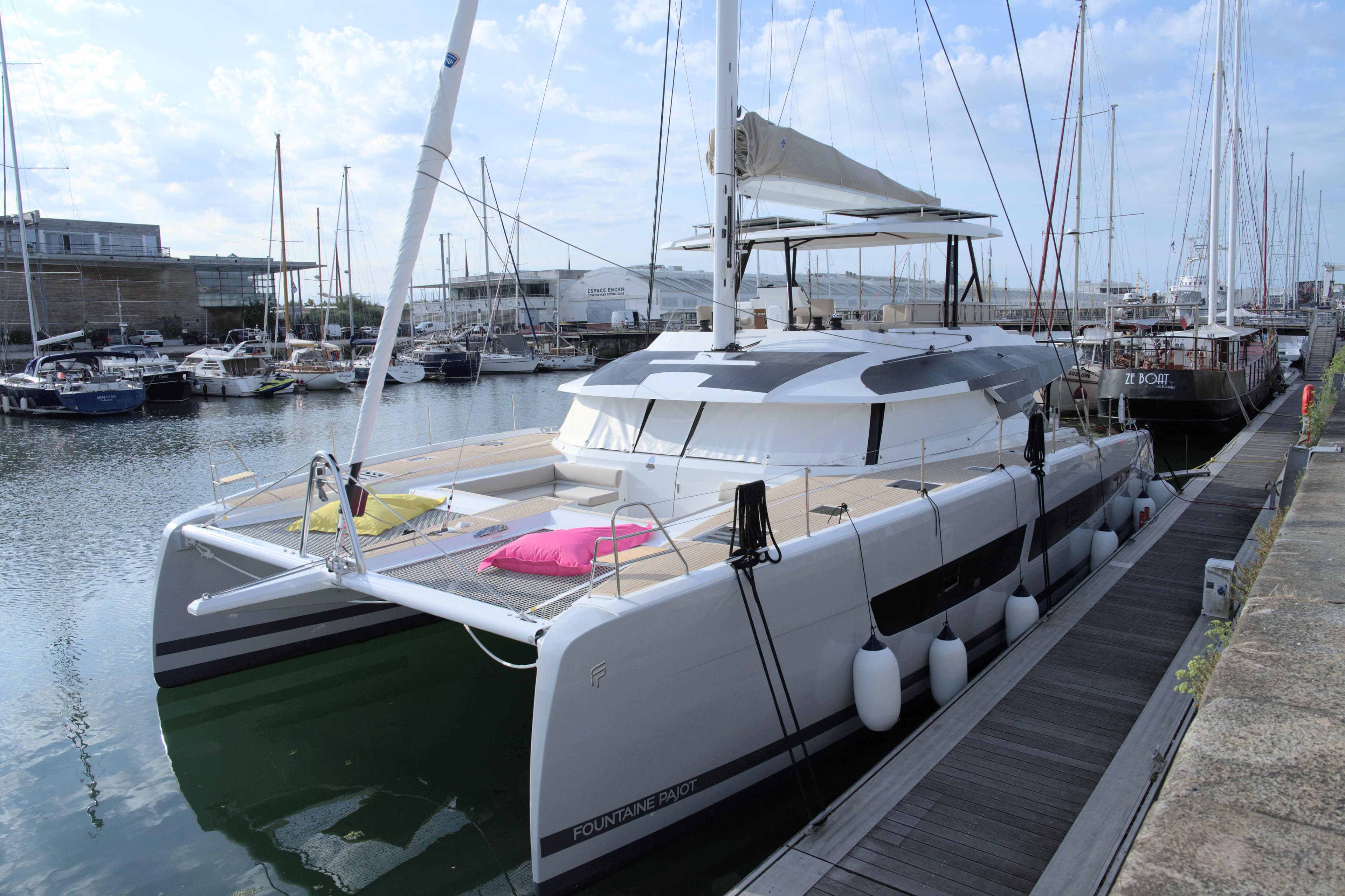 2023 Fountaine Pajot Samana 59 catamaran docked in a marina, featuring modern design.