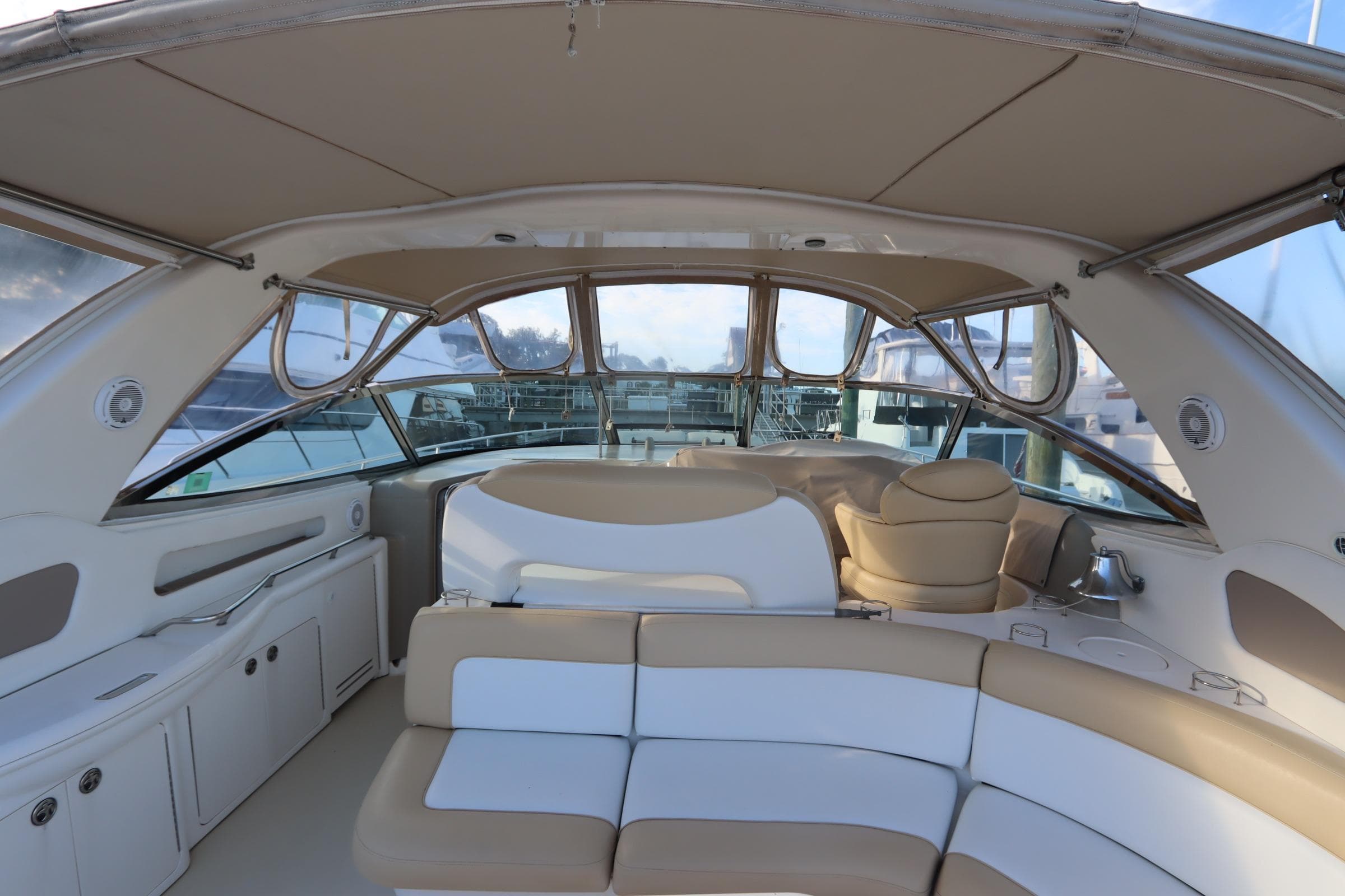Interior view of 2000 Sea Ray 460 Sundancer yacht with beige seating and canopy.