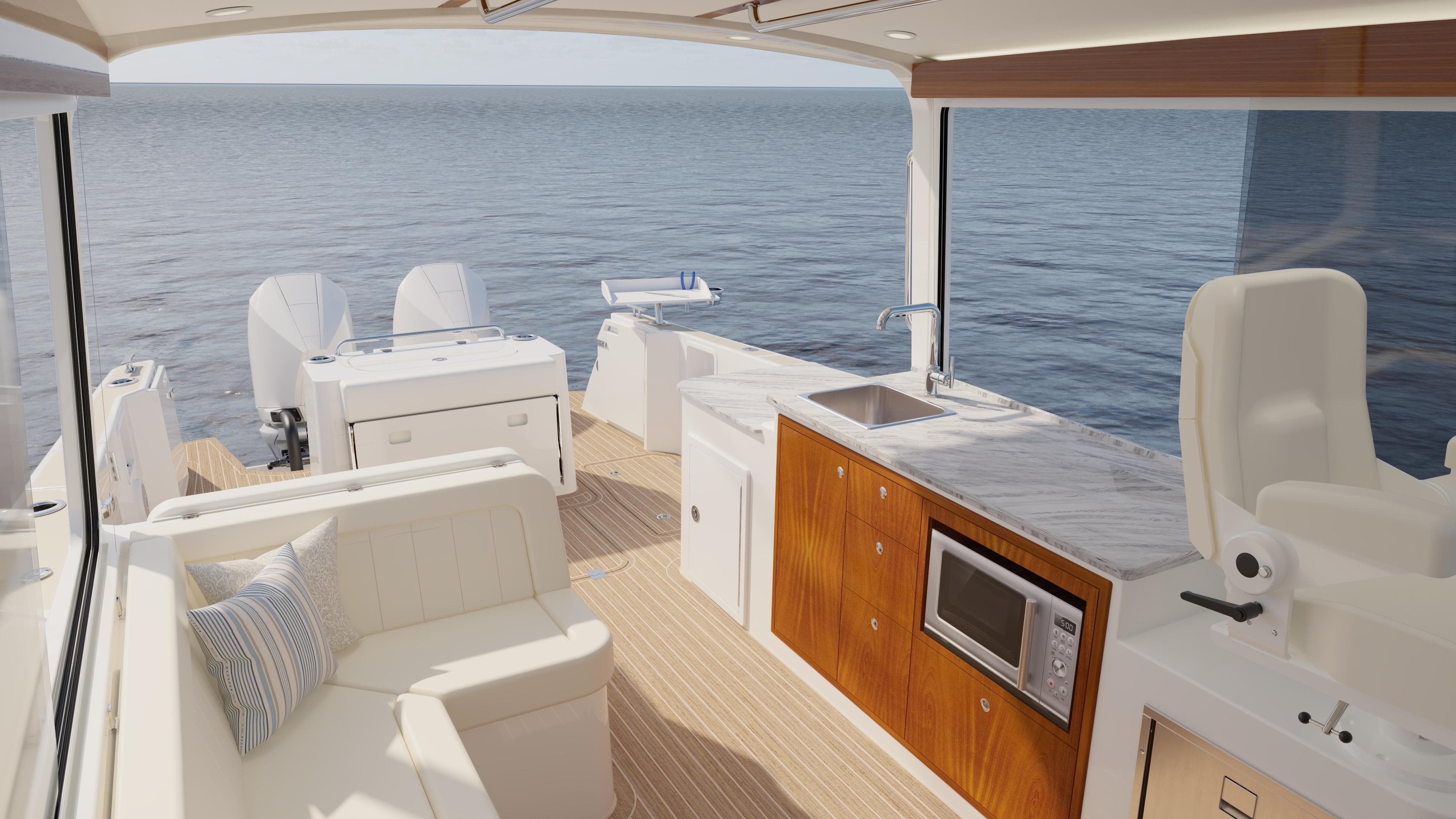 Luxurious 2026 MJM 38R yacht interior with modern kitchen and seating, overlooking serene ocean.