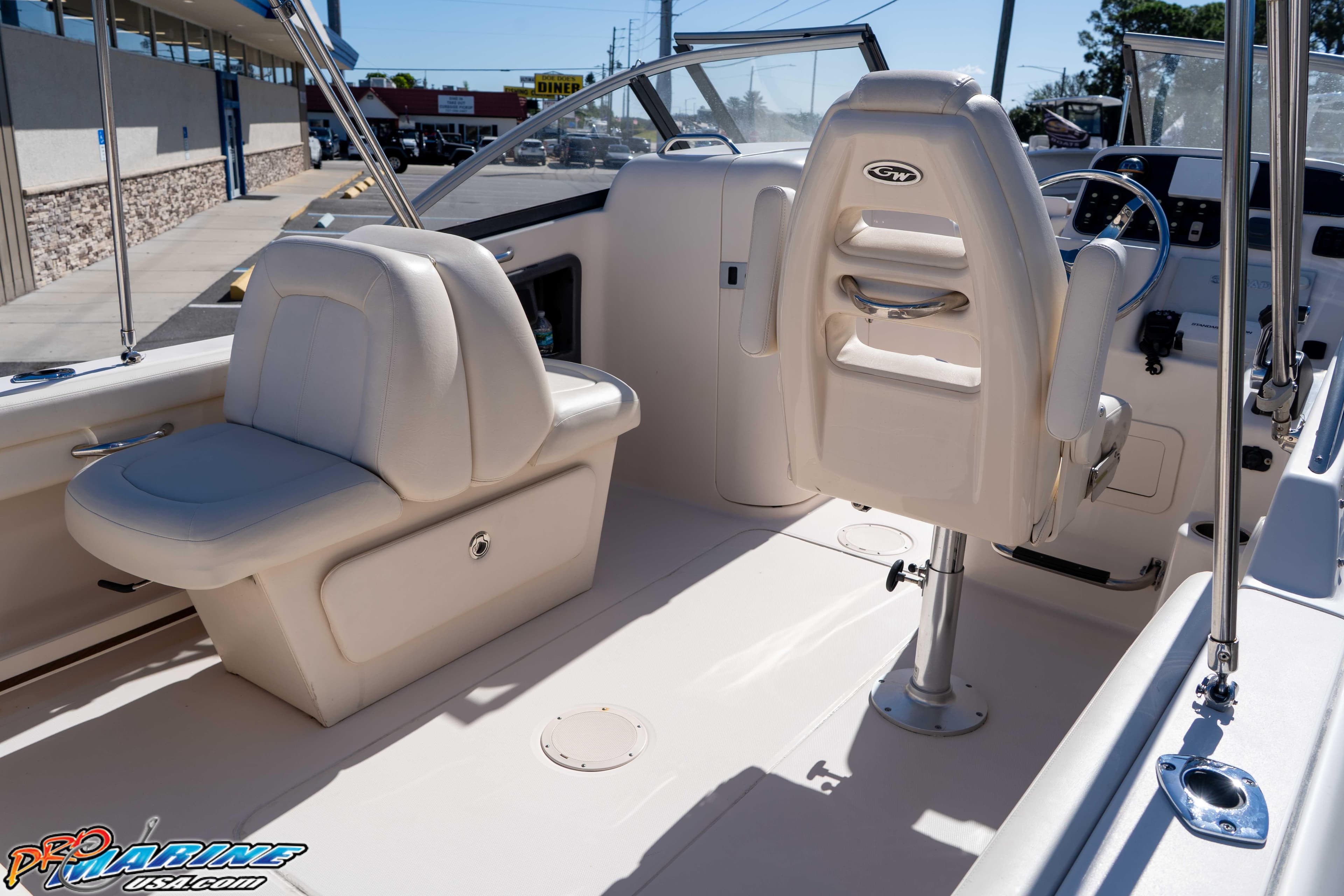 2016 Grady-White Freedom 225 boat interior with seating and steering console.