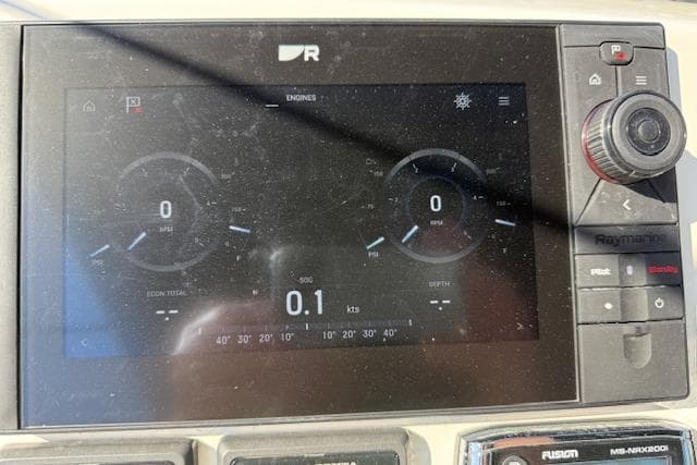 Prestige 500 yacht dashboard display showing engine metrics and speed in knots.