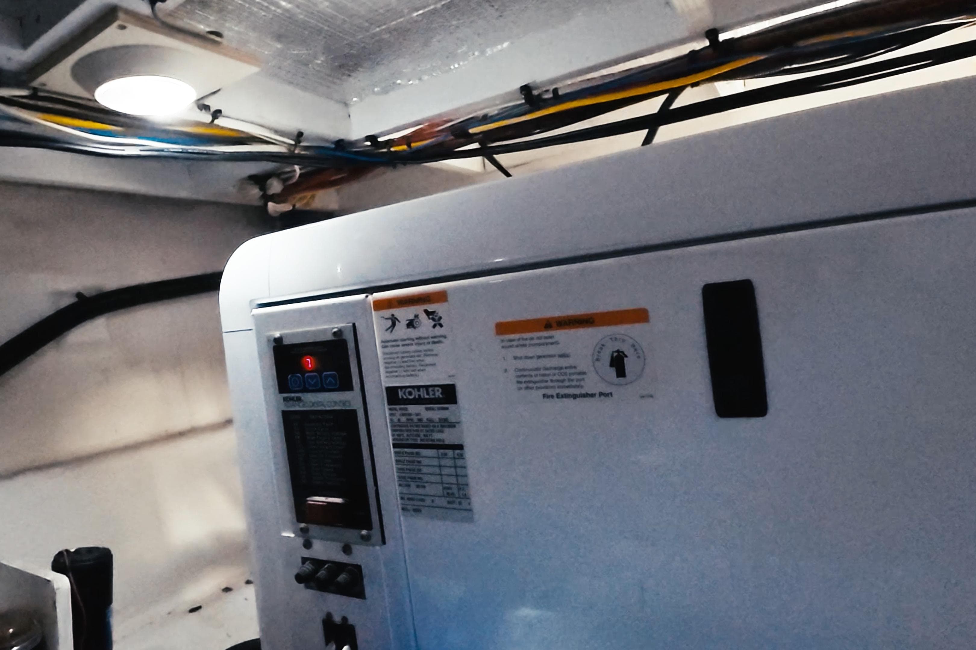 Engine room of a 2008 Silverton 43 Sport Bridge with Kohler generator.