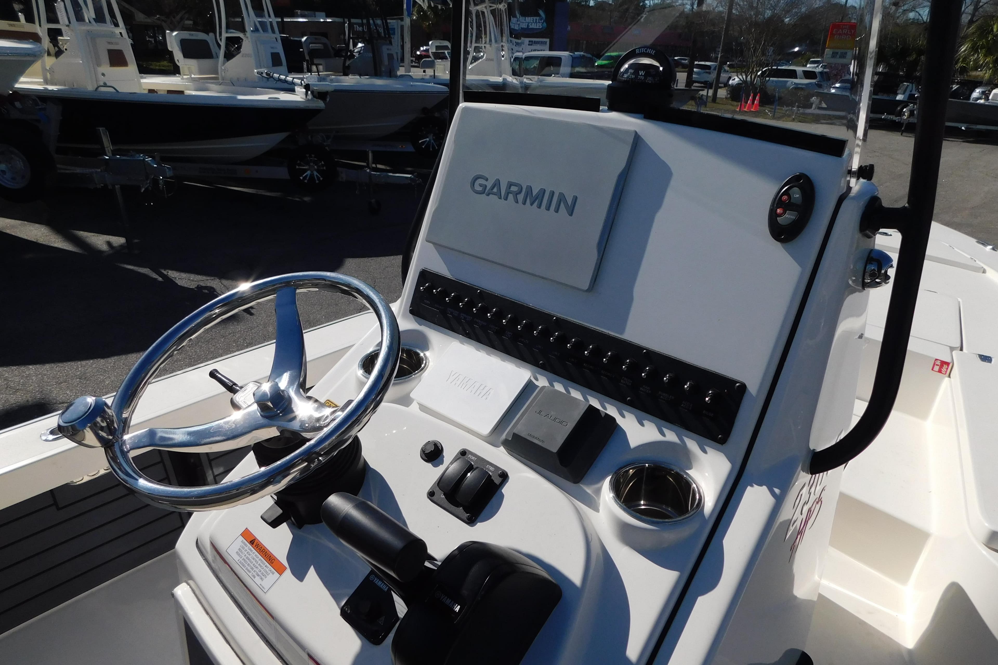 2026 Pathfinder 2300 HPS boat console with Garmin navigation system and steering wheel.
