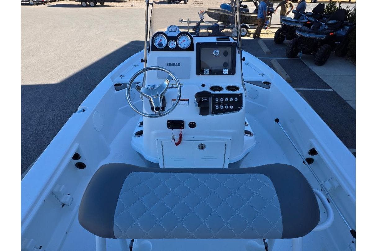 2026 NauticStar 194 Bay boat interior with steering console and seating.