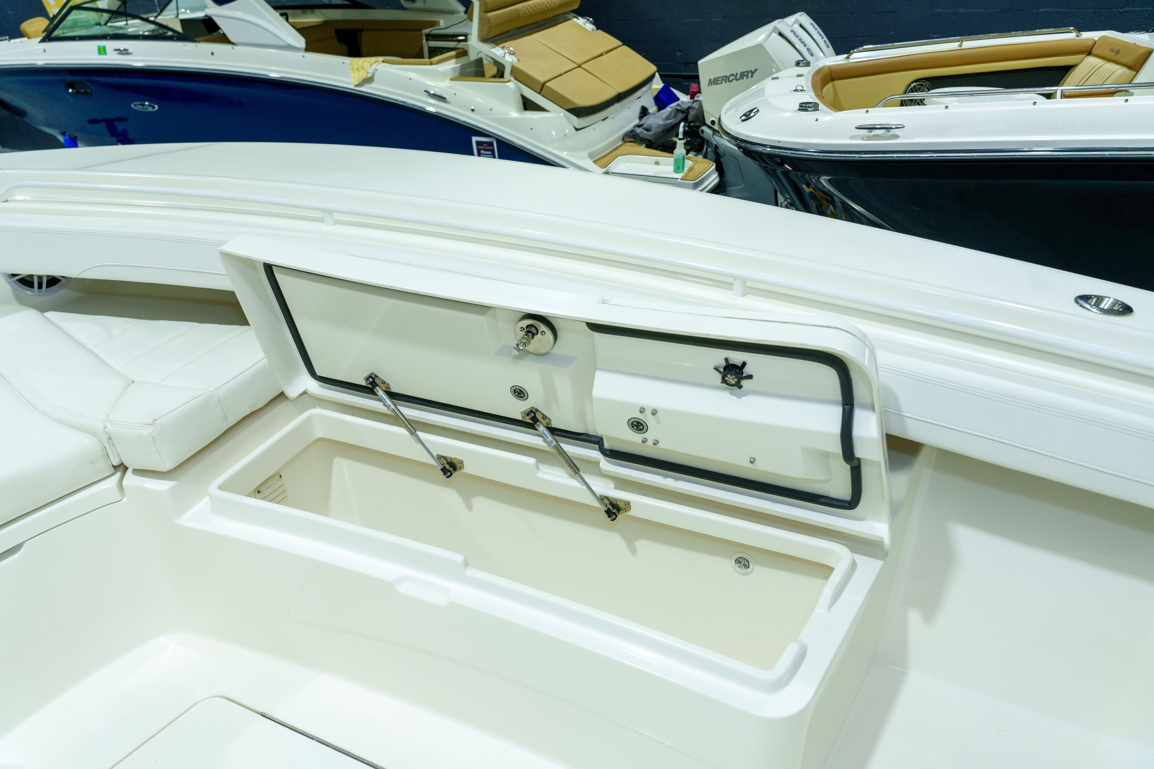 2023 Regulator 28 boat interior with open storage compartment, showcasing sleek design.