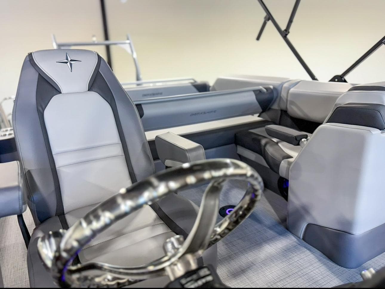 2025 Berkshire 23SBE STS boat interior with sleek seating and modern steering wheel design.