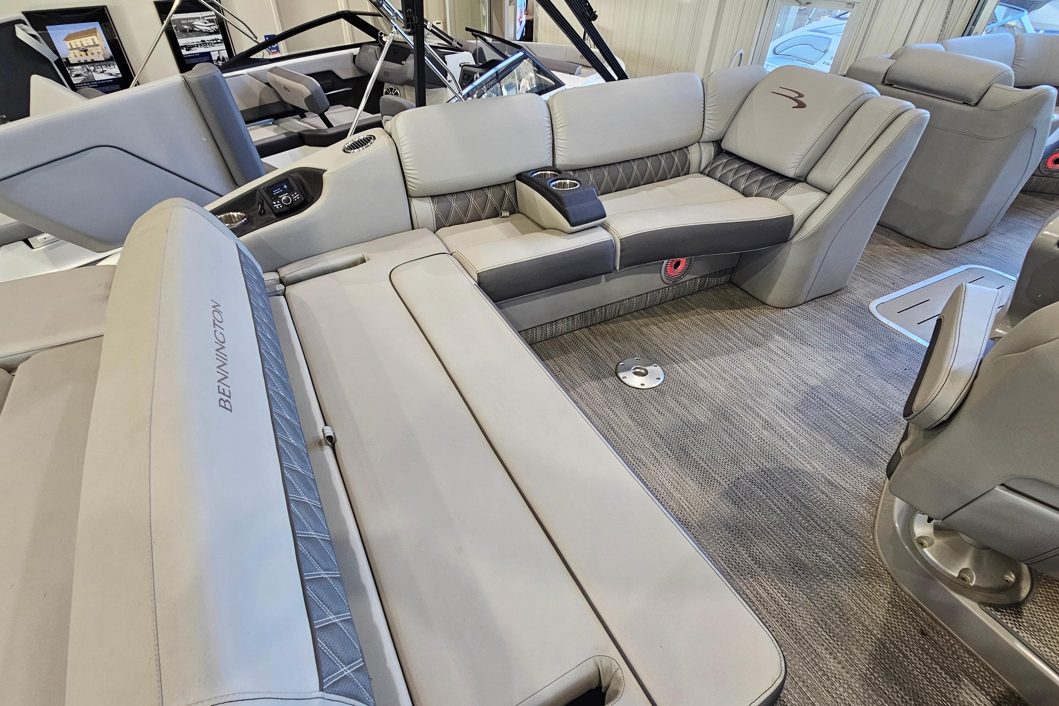 Luxurious interior of 2020 Bennington 23 R Swingback pontoon boat with plush seating.