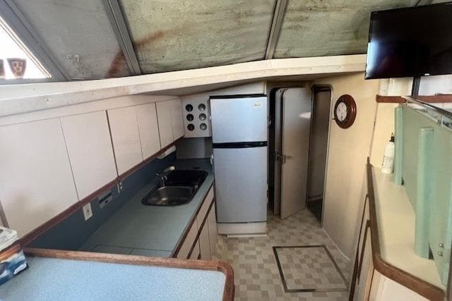 Interior of 1989 Trojan 12 Meter Motor Yacht kitchen with appliances and cabinetry.