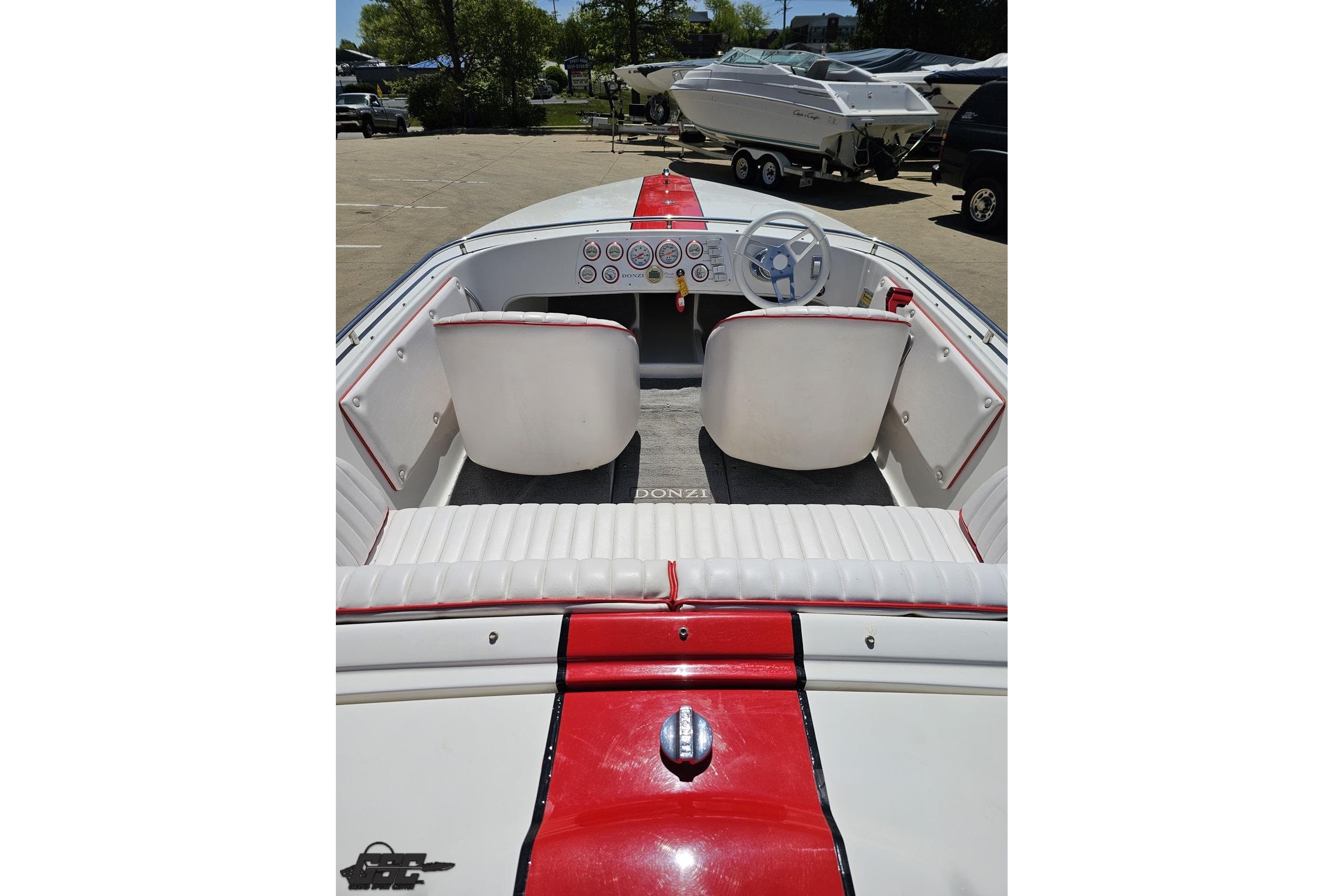 1997 Donzi 18 Classic boat interior with red and white seating and dashboard.