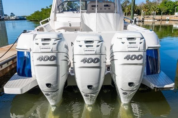 2023 Intrepid 438 Evolution with triple 400 Verado engines docked at marina.