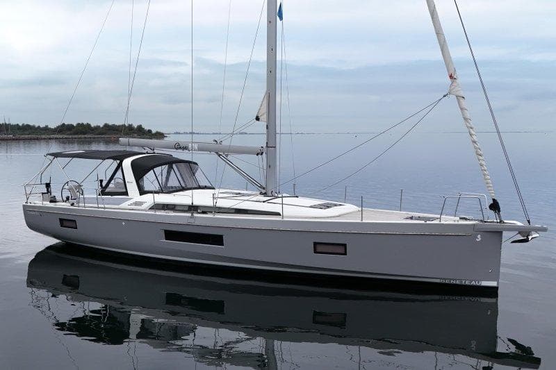 Beneteau Oceanis 51.1 sailboat, 2022 model, on calm water with clear sky.