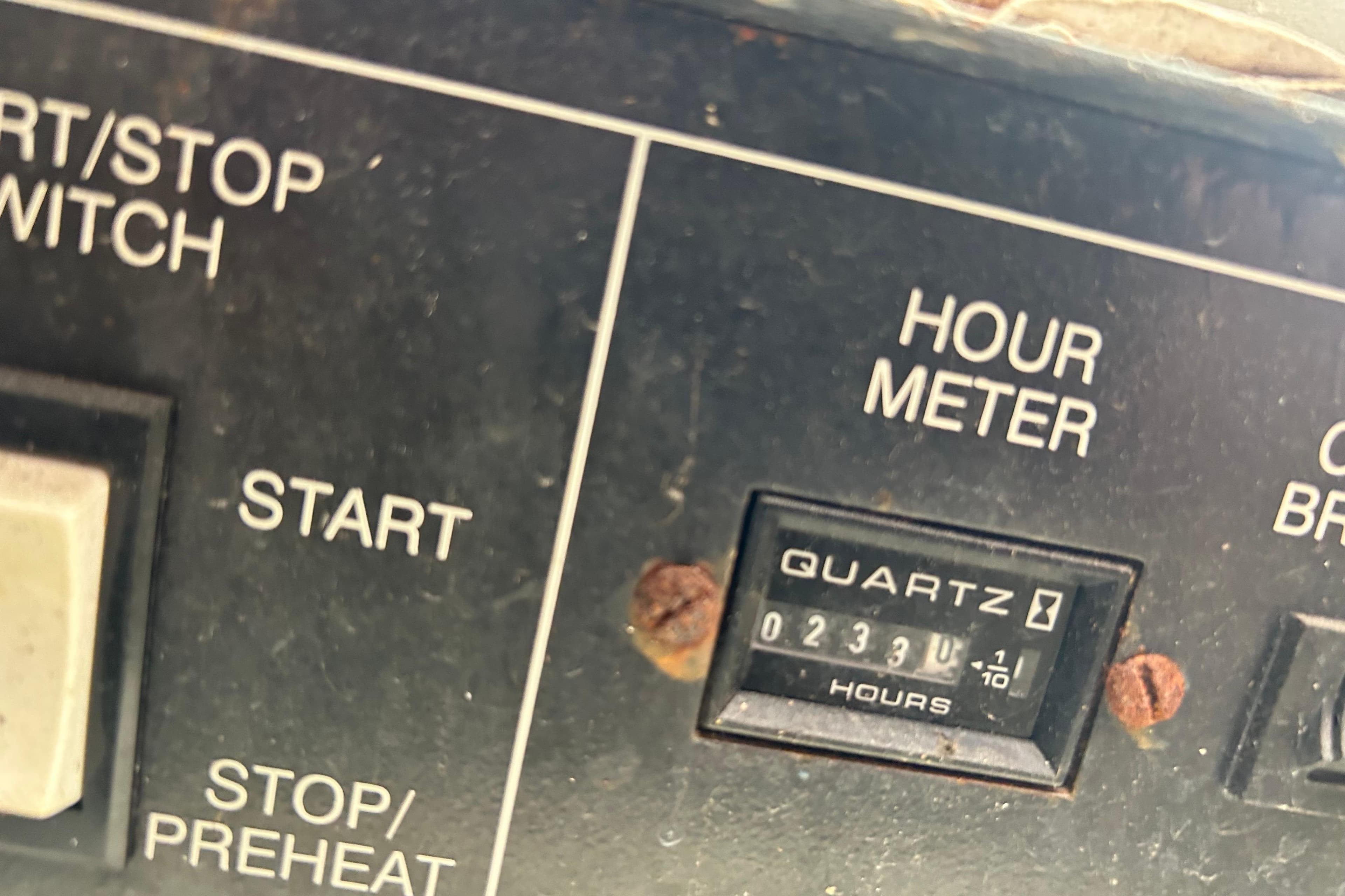Hour meter panel on 1998 Bayliner 5788 Pilot House Motoryacht showing 233 hours.
