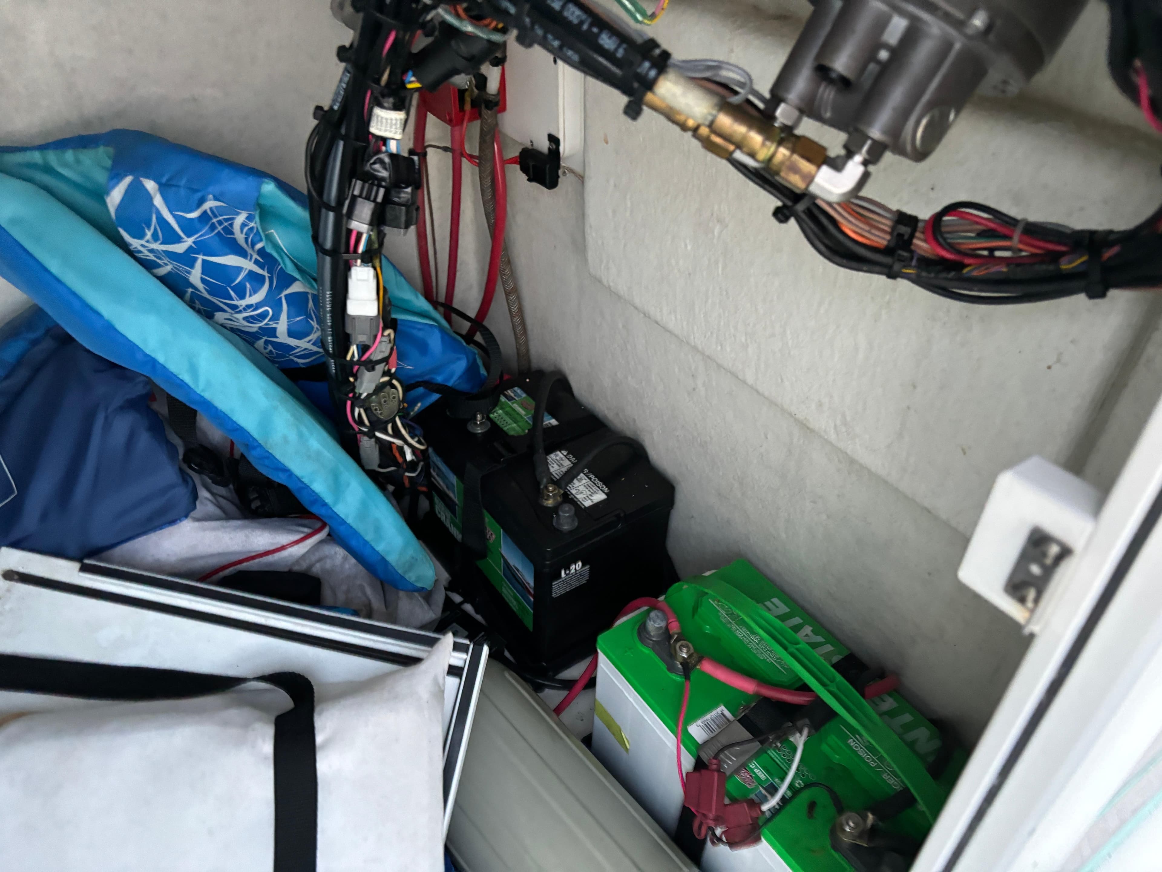 Interior of a 2021 KenCraft 21 boat showing batteries and wiring.
