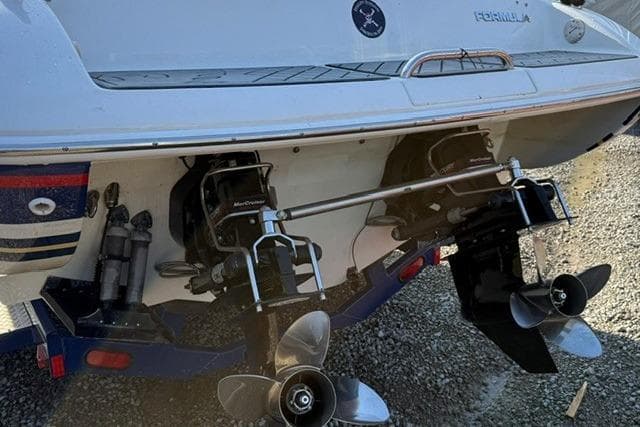 Rear view of a 2004 Formula 292 FASTech boat with dual propellers.