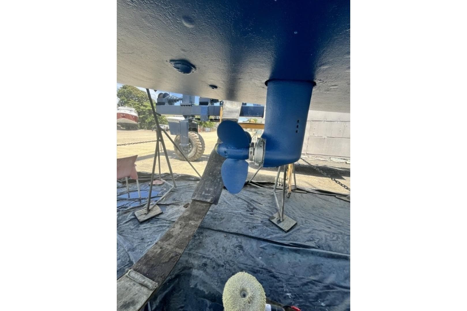 Underwater view of Bavaria 44 sailboat's propeller and rudder, 2003 model, in dry dock.