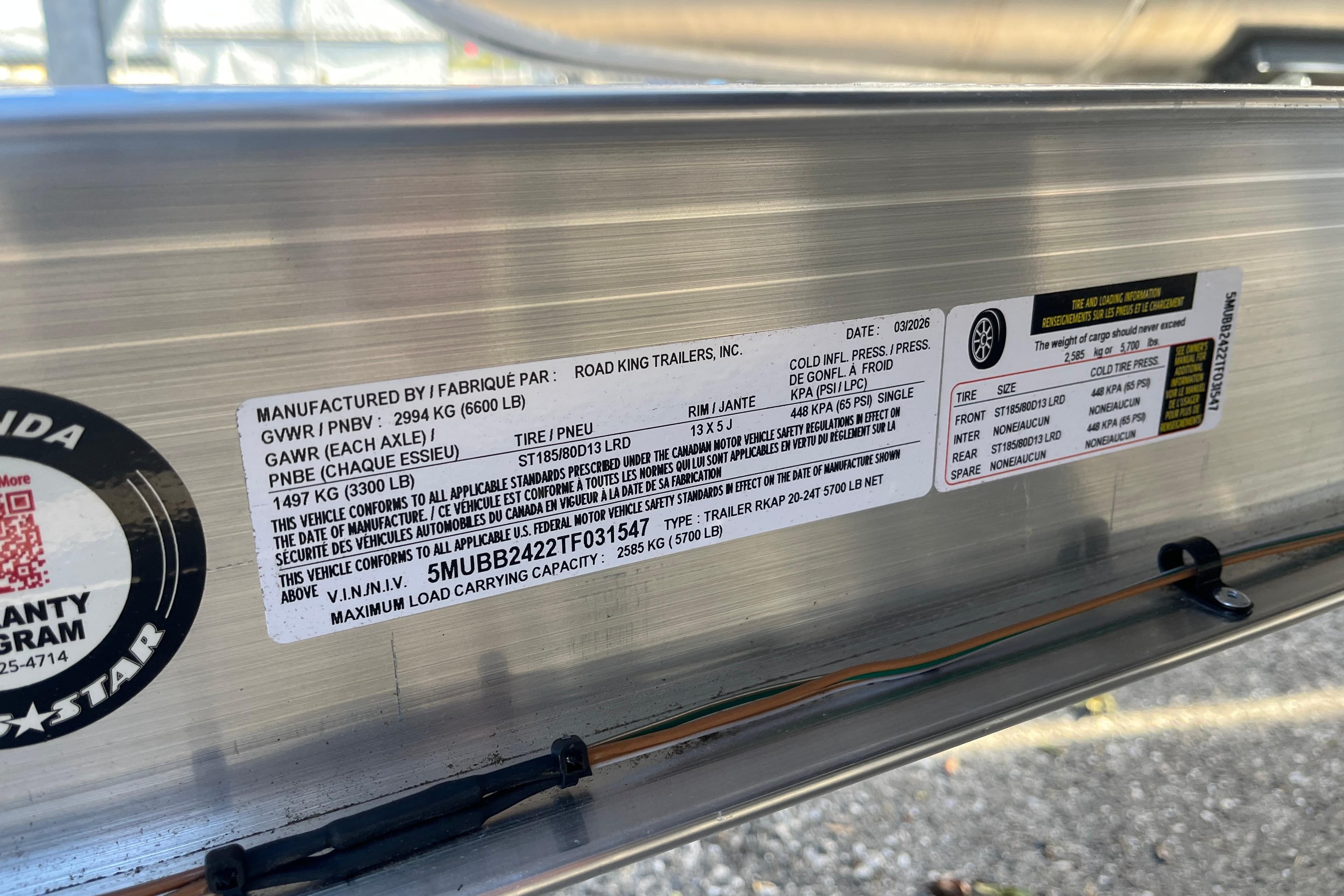 Label on Starcraft EXS 1 Q DH trailer, 2026 model, detailing specifications and safety standards.