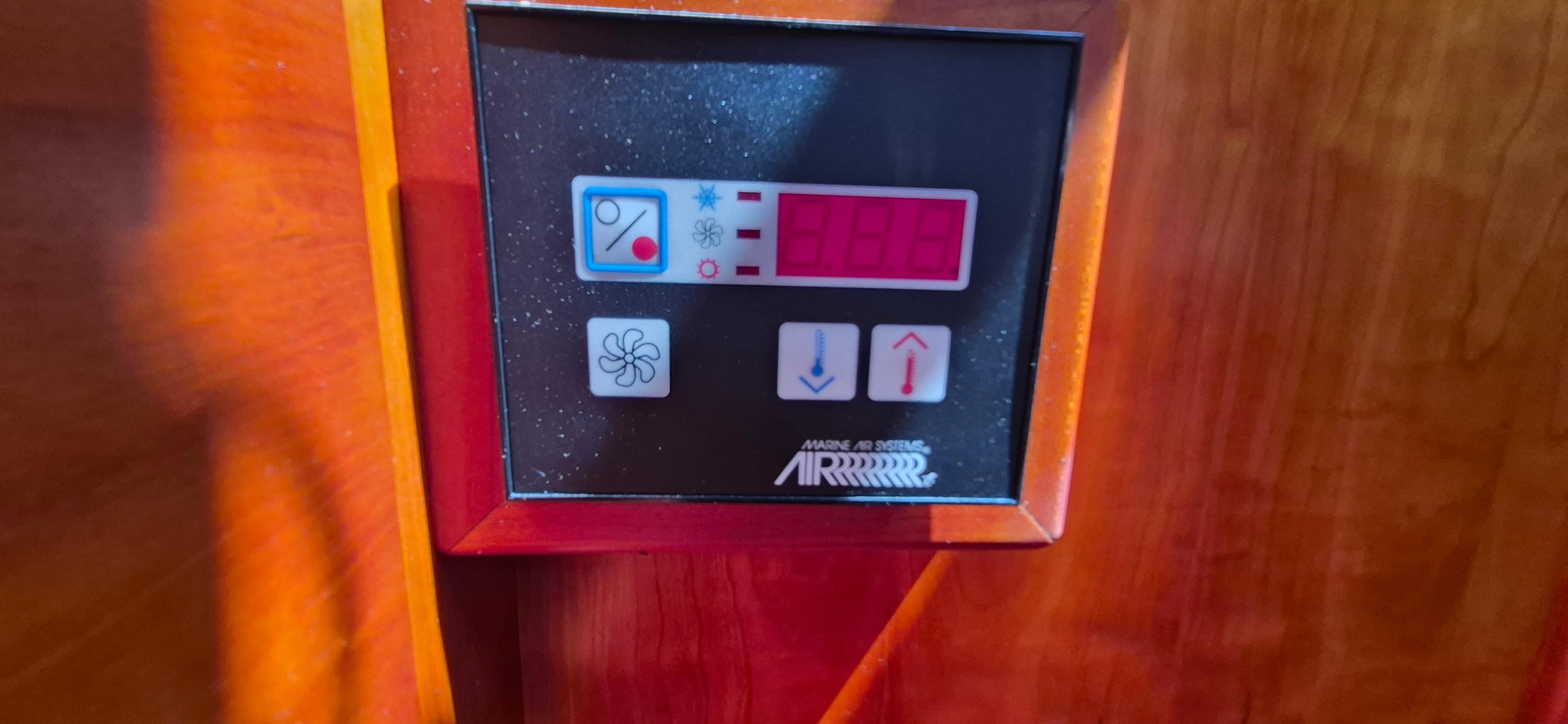 Control panel on 1997 Able 44 Downeast Express Cruiser, featuring temperature and fan settings.