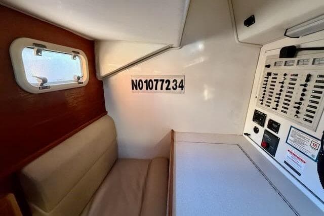 Interior of 1999 Caliber 40LRC sailboat with seating and control panel.