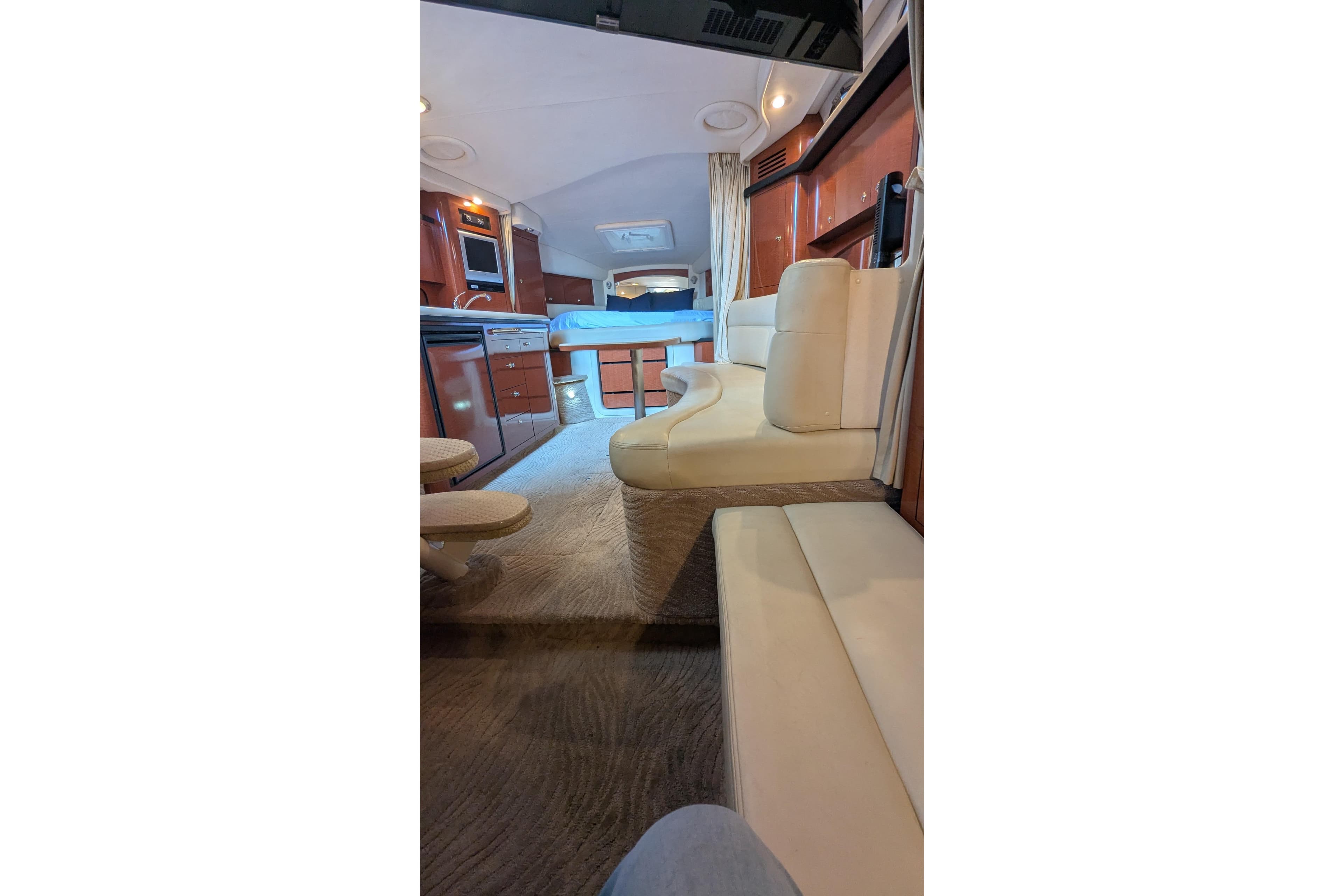Interior of 2004 Sea Ray 340 Sundancer yacht with luxurious seating and modern amenities.