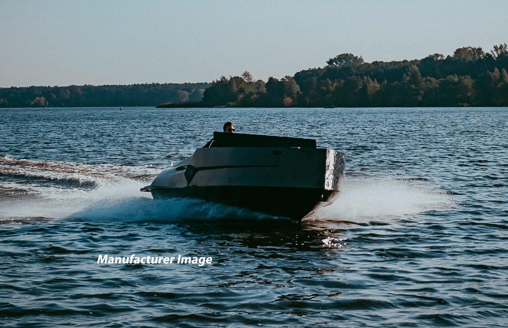 2024 D-Boat 22 Diamond Series cruising on a serene lake.