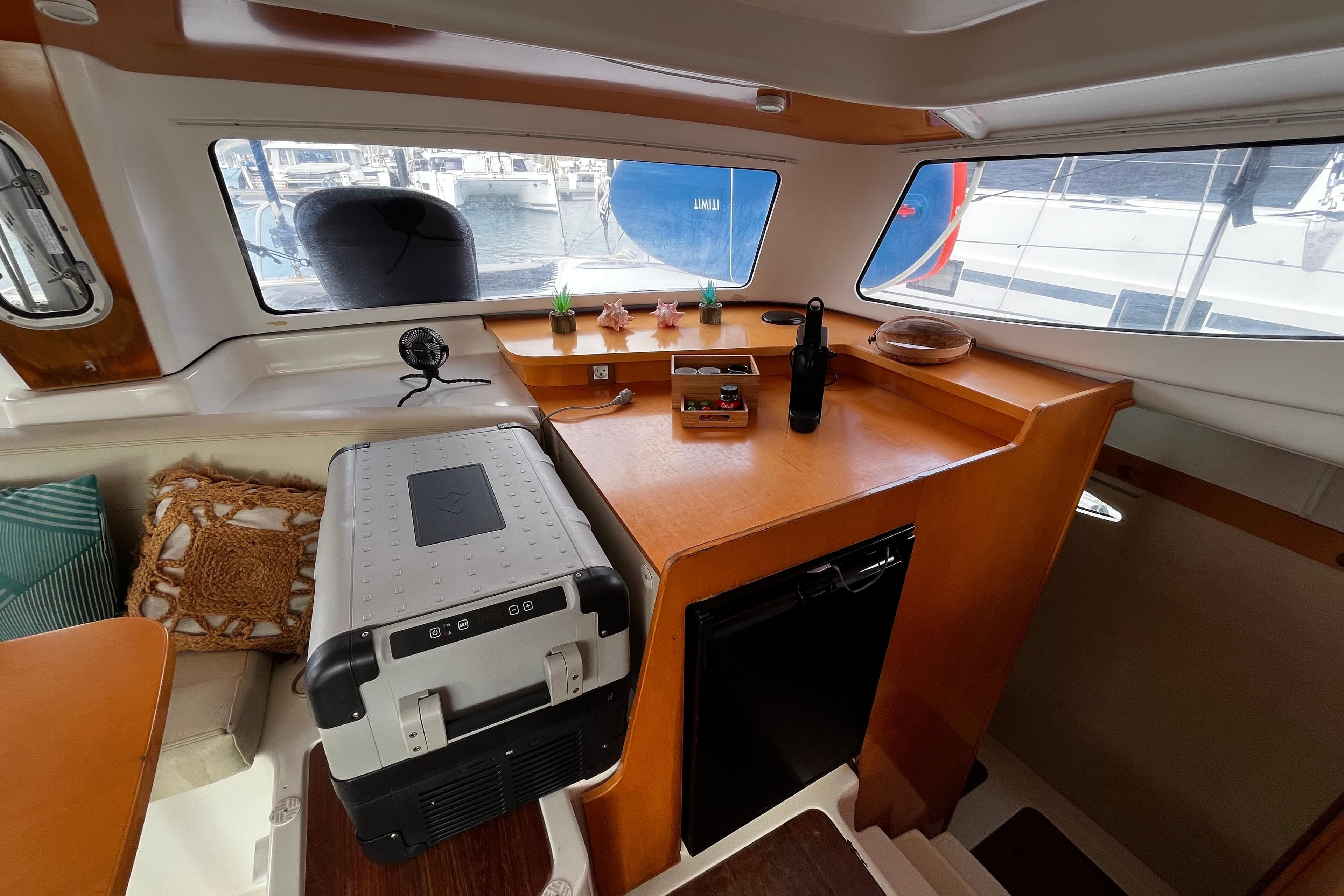 Interior of 2007 Fountaine Pajot Mahe 36 catamaran with kitchenette and seating area.
