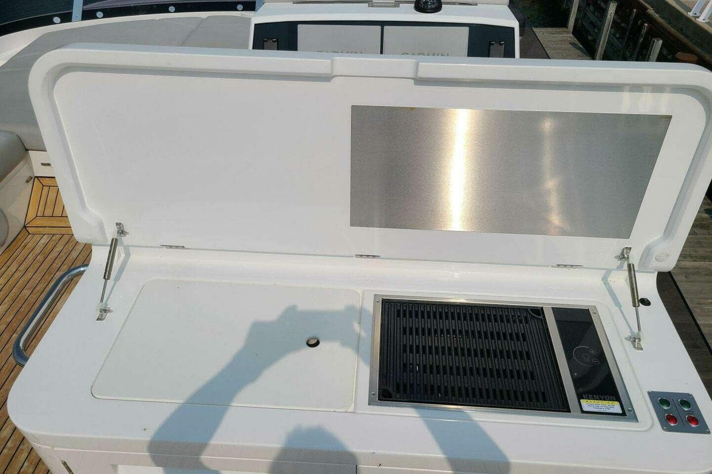 Outdoor grill on 2023 Sunseeker Manhattan 68 yacht deck, featuring sleek design and modern amenities.